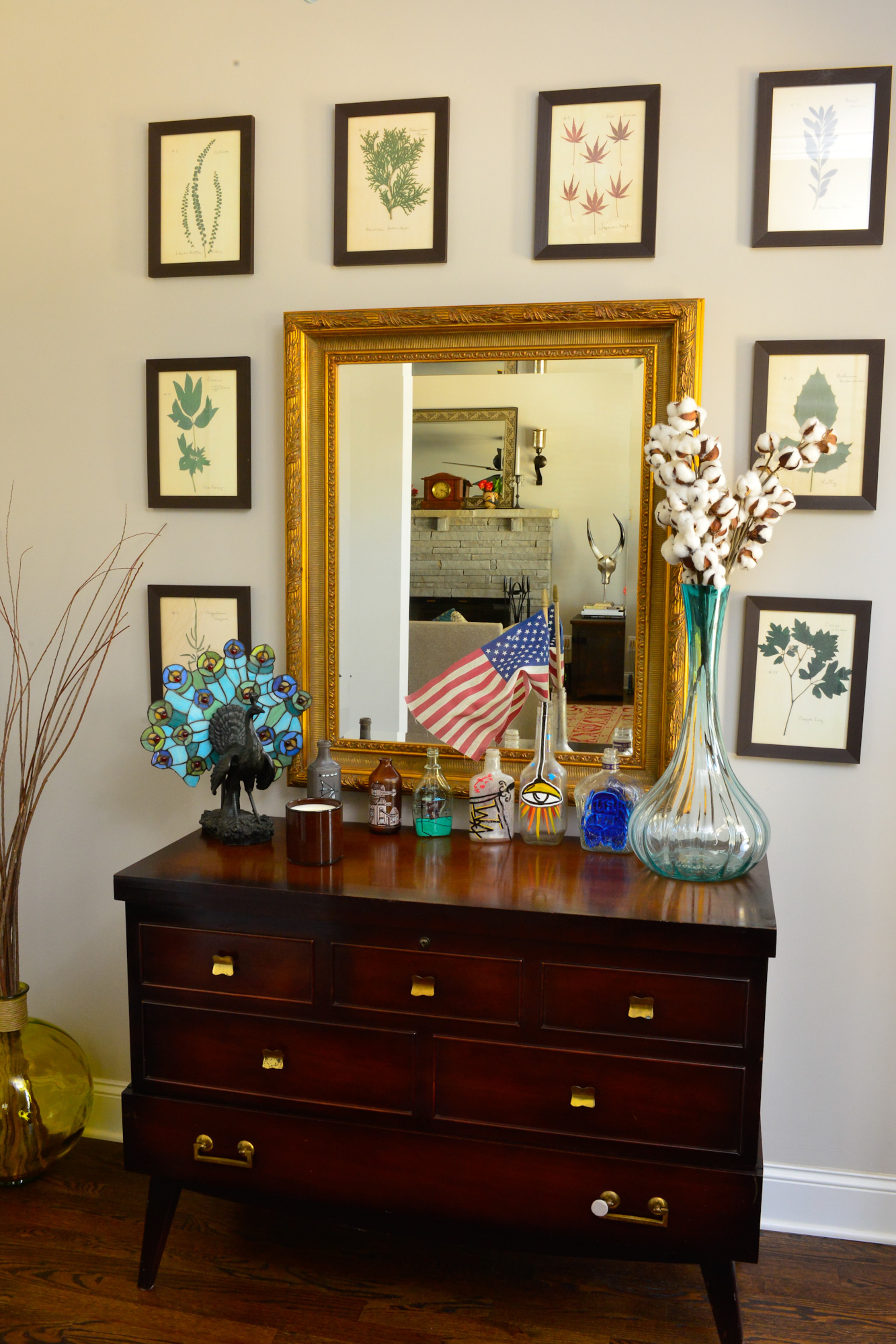 Botanical prints and real bolls of cotton in a vase welcome guests to the Atlanta home's entryway. Stanton Jacobs of Georgian Fine Properties built the home in 2014. Text by Lori Johnston and Keith Still/Fast Copy News Service.