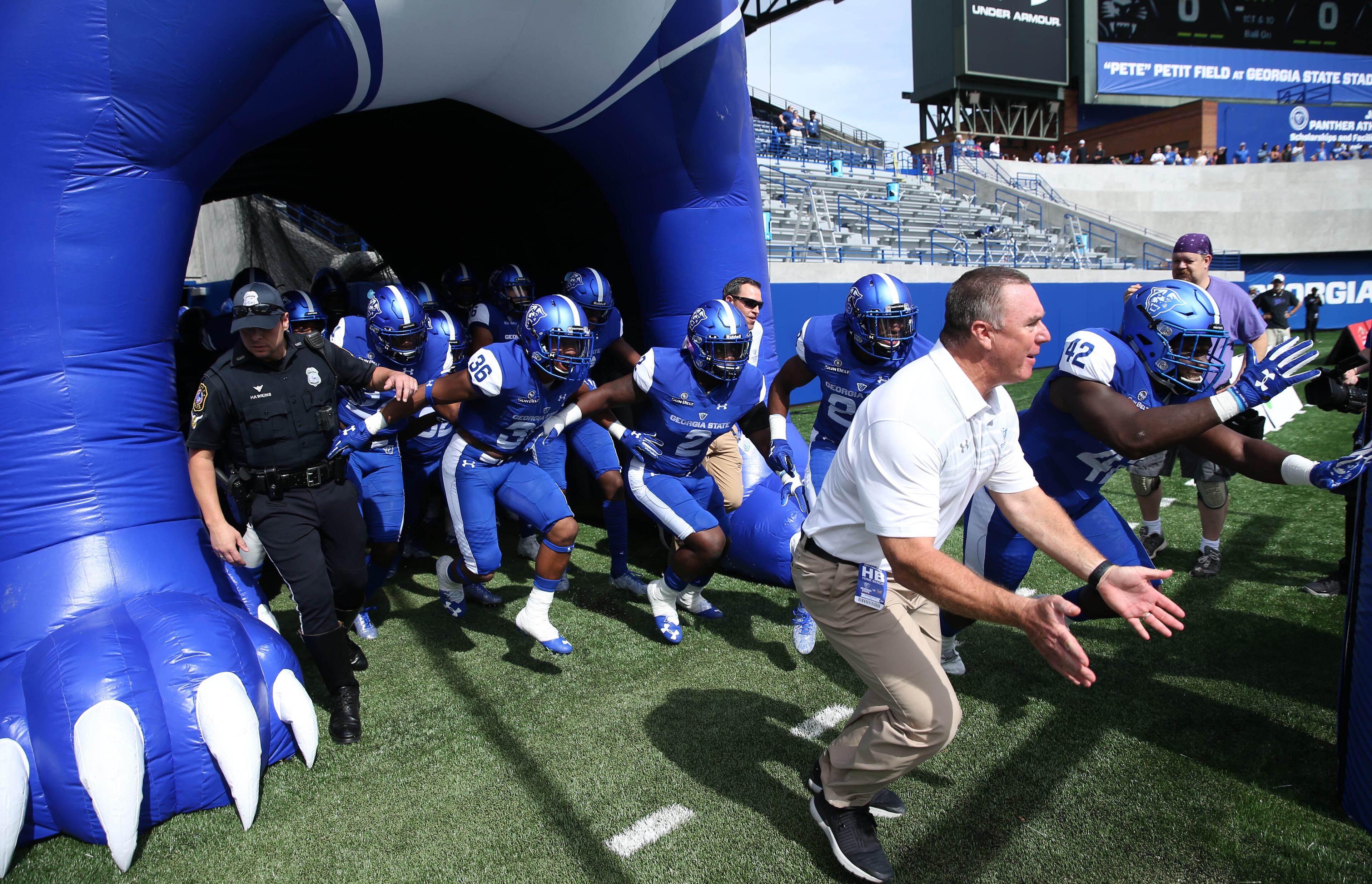 October 21, 2017 - Atlanta, Ga: Georgia State Panthers head coach Shawn Elliott runs onto the field with players before their game against the Troy Trojans at GSU Stadium Saturday, October 21, 2017, in Atlanta.. PHOTO / JASON GETZ
