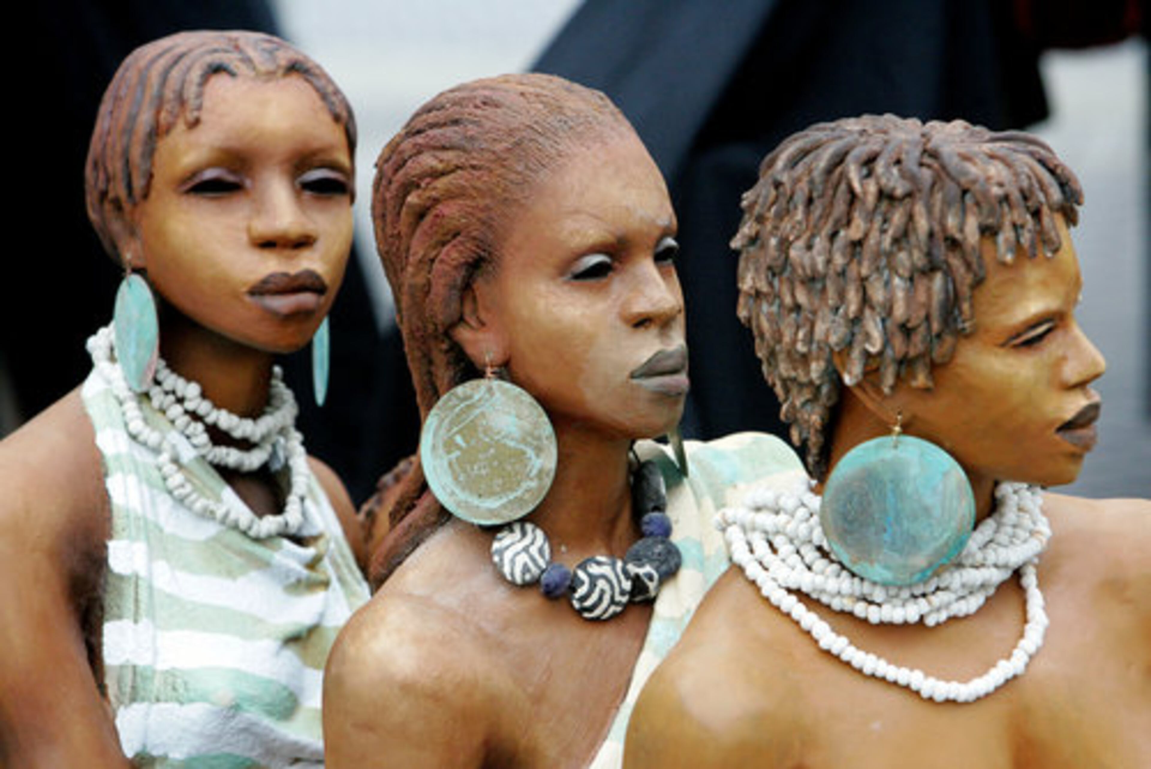 Three ceramic sculpture by Woodrow Nash from Akron, Ohio, wait to be set up for display Friday at the National Black Arts Festival. In Midtown, 15th Street will be shut down this weekend for free concerts and the International Marketplace, where clothing, jewelry and art will be on sale and display.