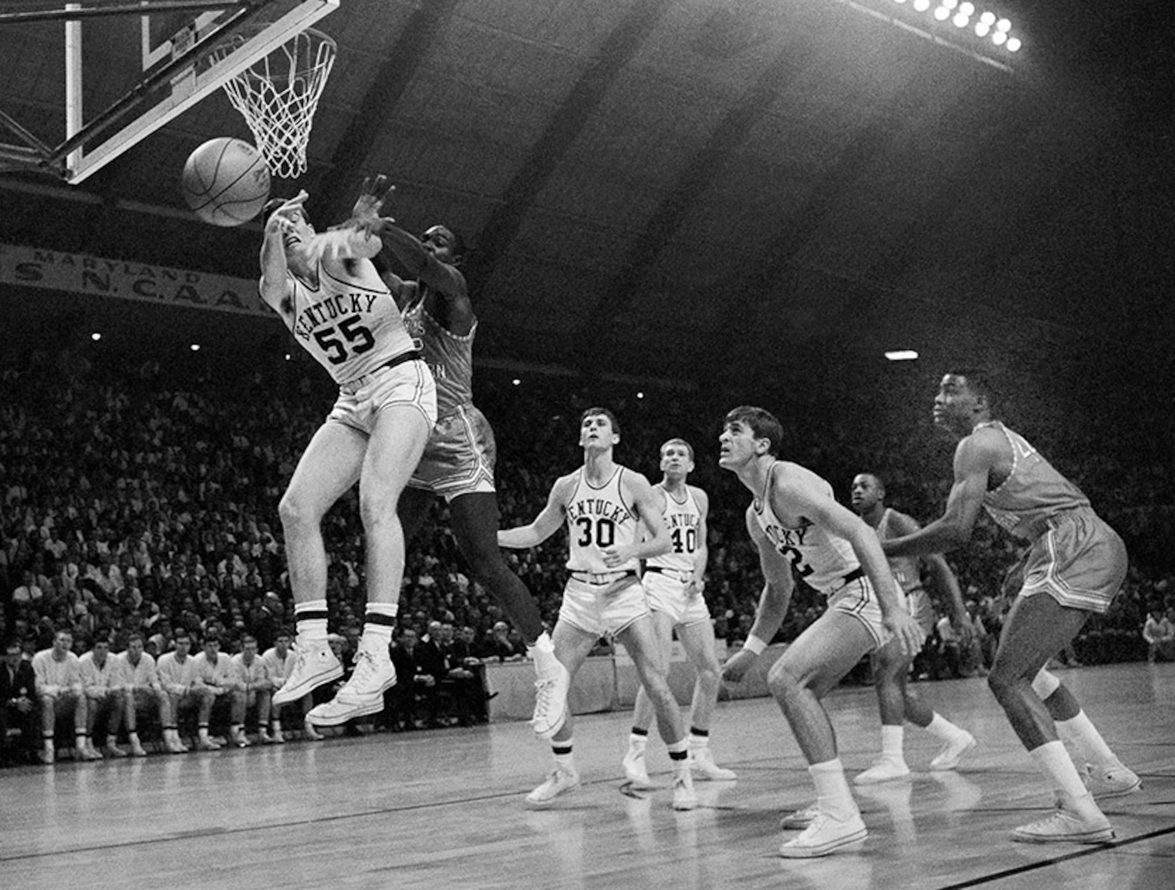 Kentucky's Thad Jaracz and Texas Western's David Lattin (42) reach for a rebound. Texas Western's team featured seven black players -- the Miners also had four whites and an Hispanic guard, none of whom played that night.
