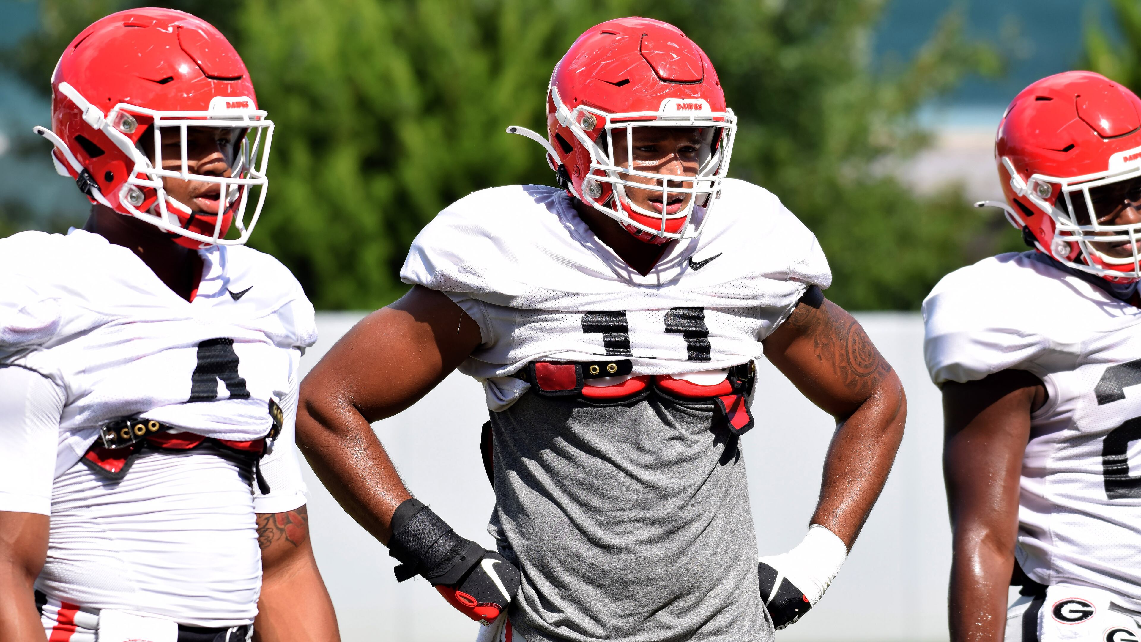 Georgia outside linebackers Nolan Smith (4) and Jermaine Johnson (11 )during the Bulldogs' practice Monday, Aug. 31, 2020, in Athens.