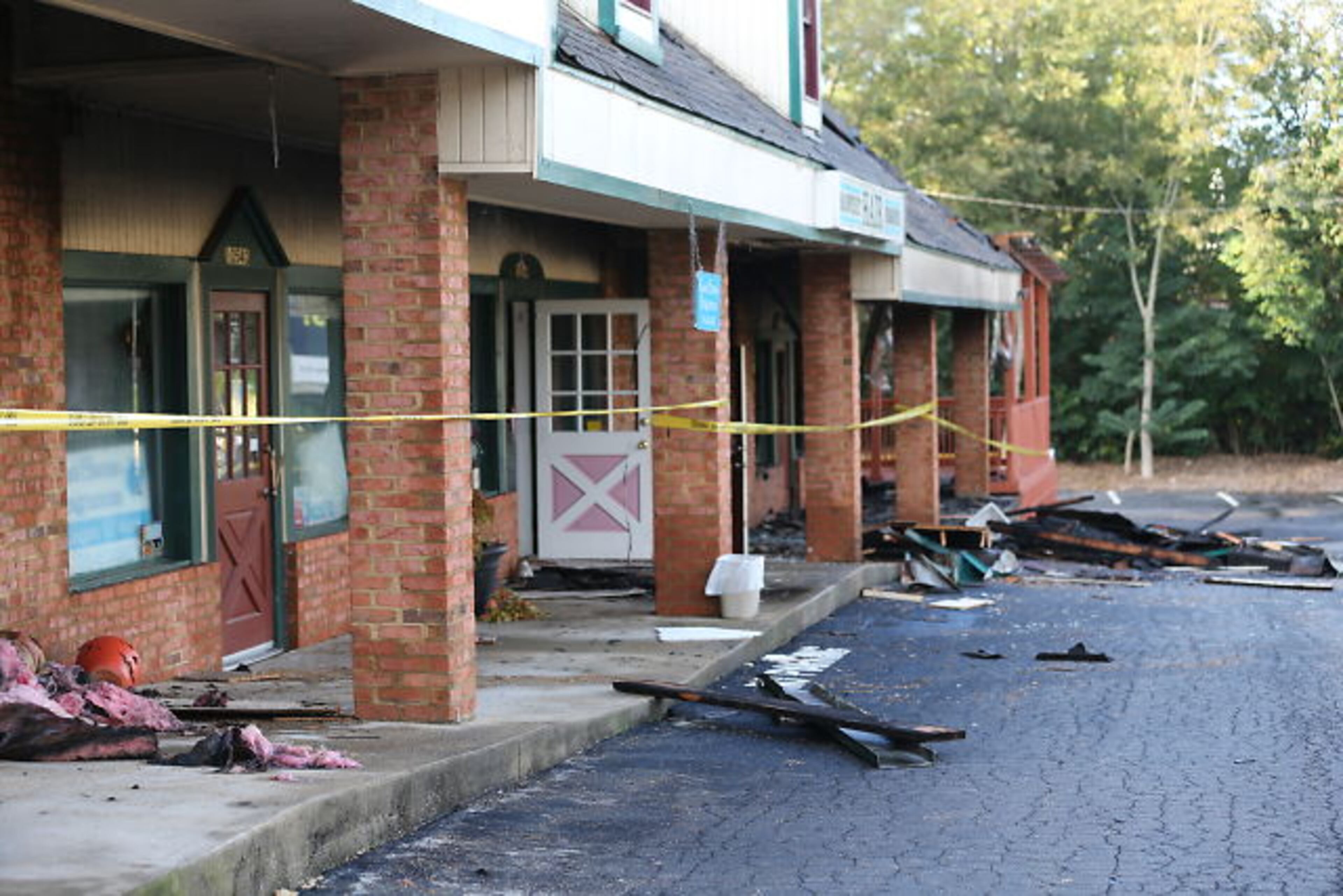 Seventeen dogs at a pet spa survived a DeKalb strip mall fire, but a Cocker Spaniel and a Shih Tzu died from smoke inhalation. JOHN SPINK / JSPINK@AJC.COM