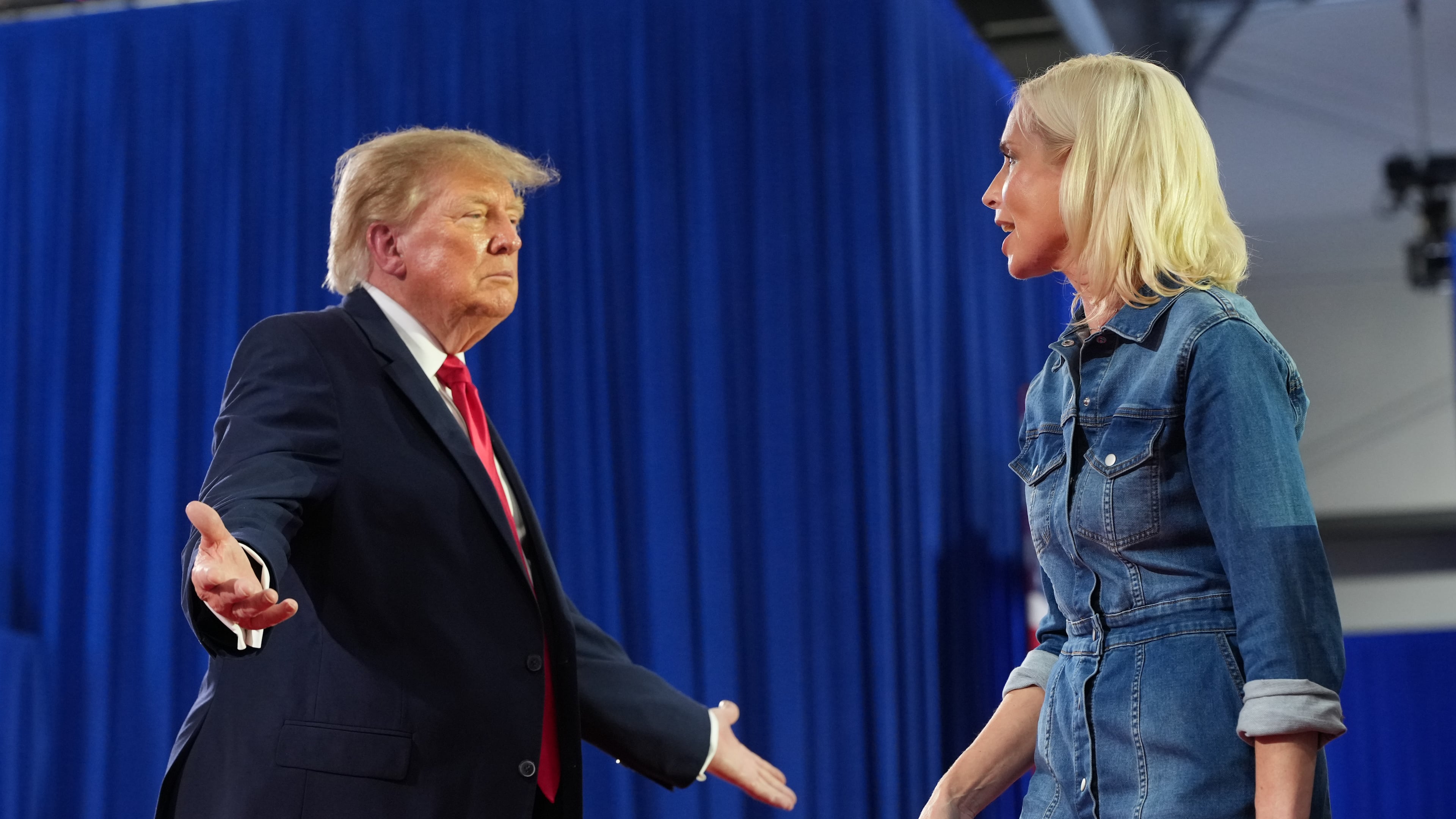President Donald Trump greets Iowa U.S. Senate candidate Rep. Ashley Hinson, R-Iowa, at a campaign rally at Sioux Gateway Airport, Thursday, Oct. 22, 2026, in Sioux City, Iowa. (AP Photo/Alex Brandon)
