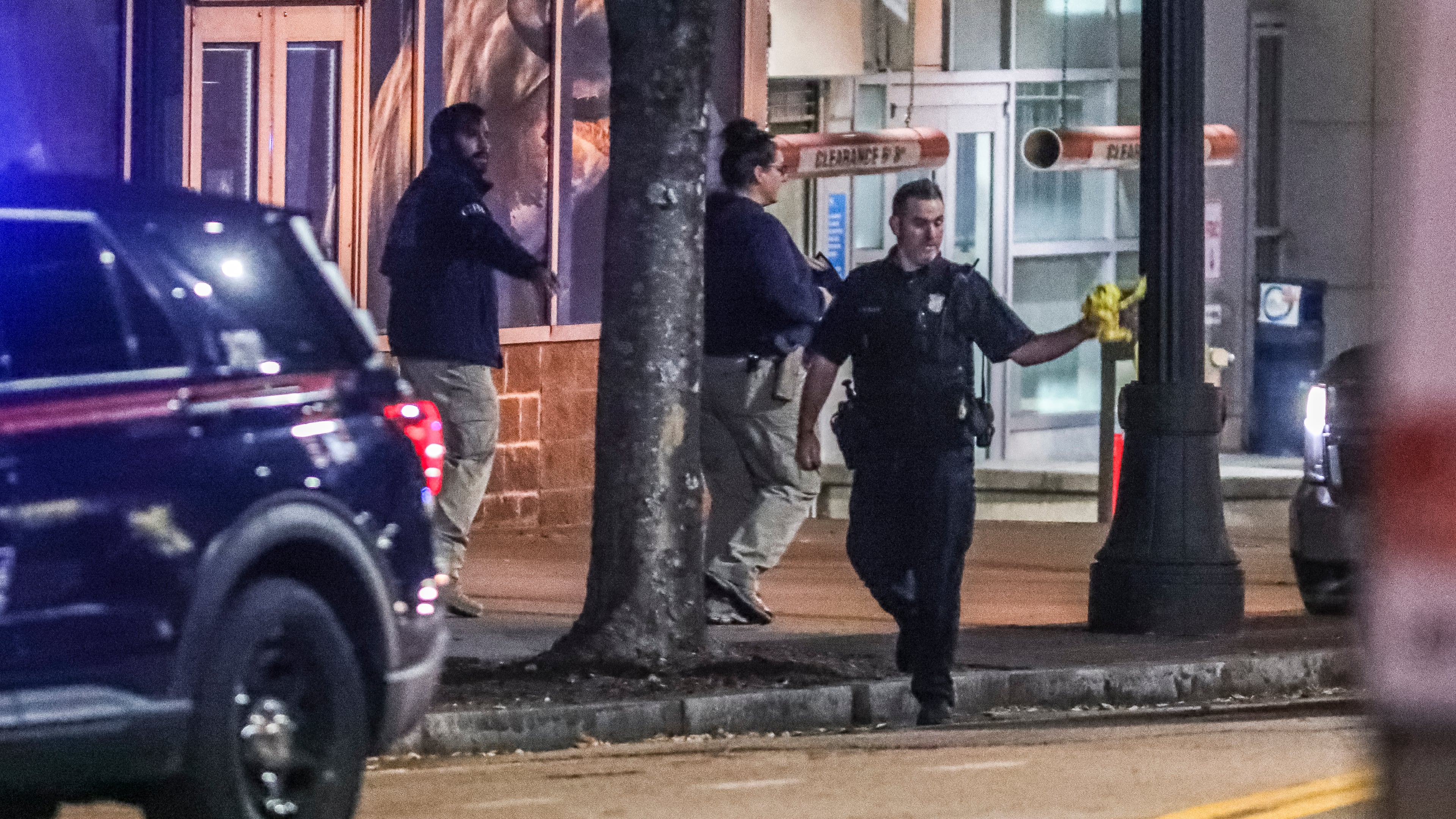 October 26, 2021 Atlanta: The GBI and Atlanta police worked the scene on Tuesday, Oct. 26, 2021 after a Molena police officer working an off-duty job in parking enforcement was shot Monday night as he was sitting in his vehicle in downtown Atlanta, officials said. The officer was working for ATL Plus when he was approached by the alleged gunman on Luckie Street shortly before 10 p.m., according to the GBI. The state agency said the officer took a bullet to the neck and returned fire, fatally wounding the man. The officer’s injuries were not considered life-threatening, GBI spokeswoman Nelly Miles said in a news release. “Agents on scene found the man who died in possession of a firearm,” she said. The names of the two men were not released. A third gunshot victim, a woman, was also found at the scene, according to Atlanta police. She was taken to a hospital with what police believed to be a graze wound. “The preliminary investigation indicates there may have been some type of altercation between the two males that escalated to gunfire,” an Atlanta police spokesman said in a statement. According to Channel 2 Action News, the officer argued with the man about a parking ticket before shots were fired. Officials have not confirmed the motive. Molena is a town of fewer than 500 in southwest Pike County, more than 60 miles south of downtown Atlanta. The injured officer serves in a reserve capacity, according to the GBI. The GBI is investigating the incident as an officer-involved shooting, the 80th such shooting this year. The Atlanta Journal-Constitution also tracks officer-involved shootings that don’t involve the GBI, and those numbers sometimes differ from the GBI’s tally. (John Spink / John.Spink@ajc.com)