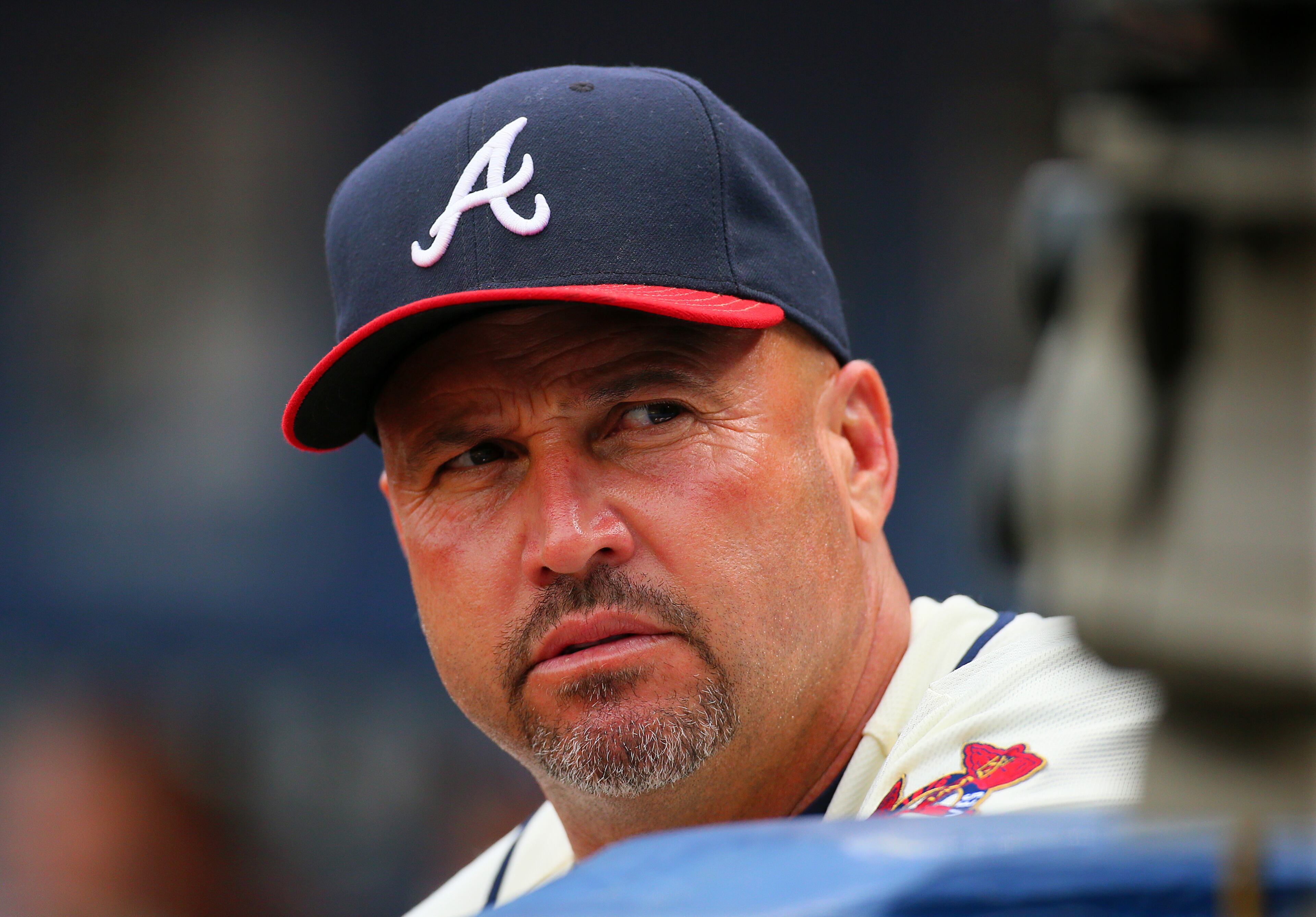 Braves manager Fredi Gonzalez watches from the dugout during first inning play against the Marlins in their MLB baseball game on Sunday, Sept. 1, 2013, in Atlanta.