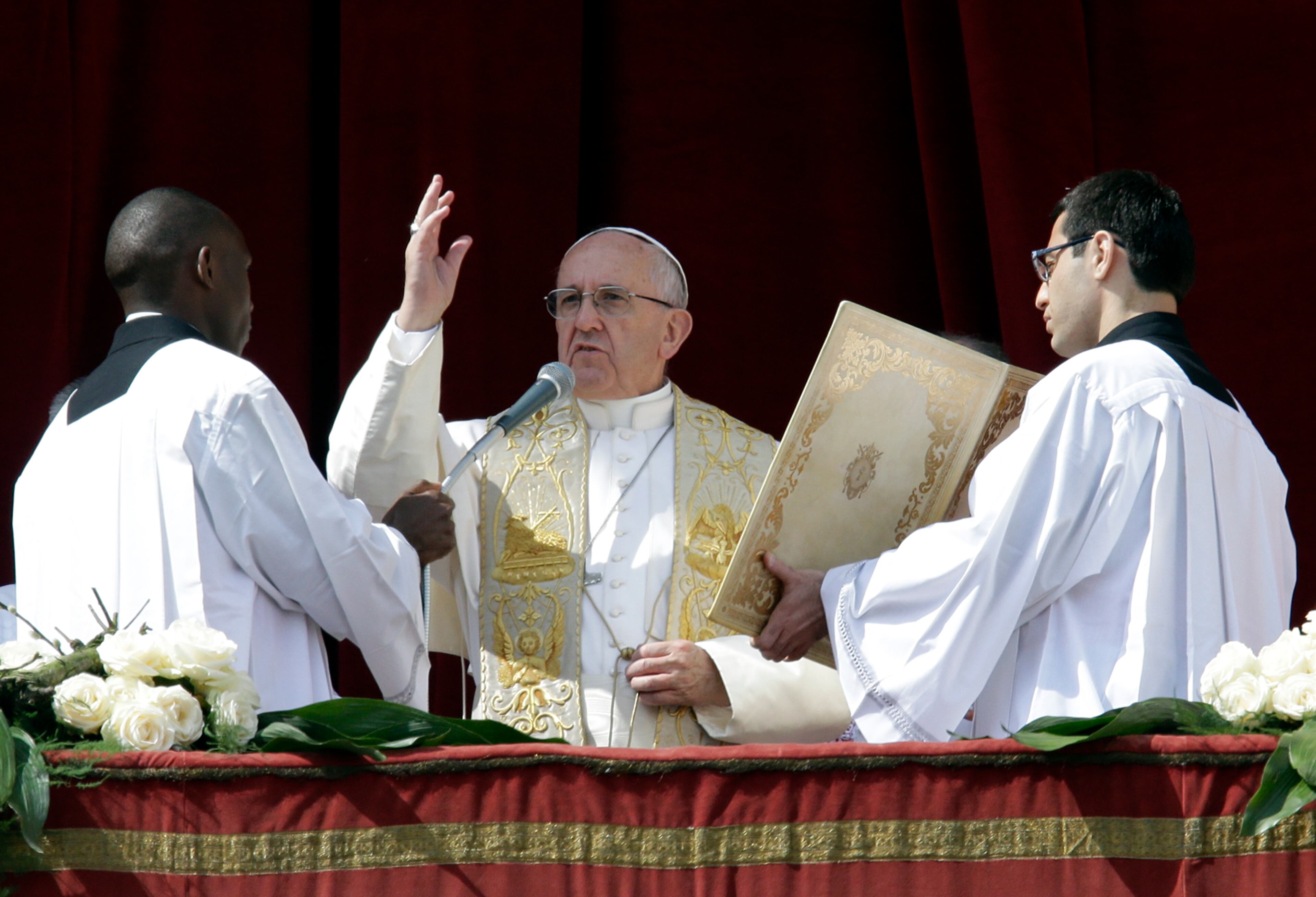 Pope Francis delivers the Urbi et Orbi (to the city and to the world) message at end of the Easter Mass, in St. Peter's Square, at the Vatican, on March 27, 2016.