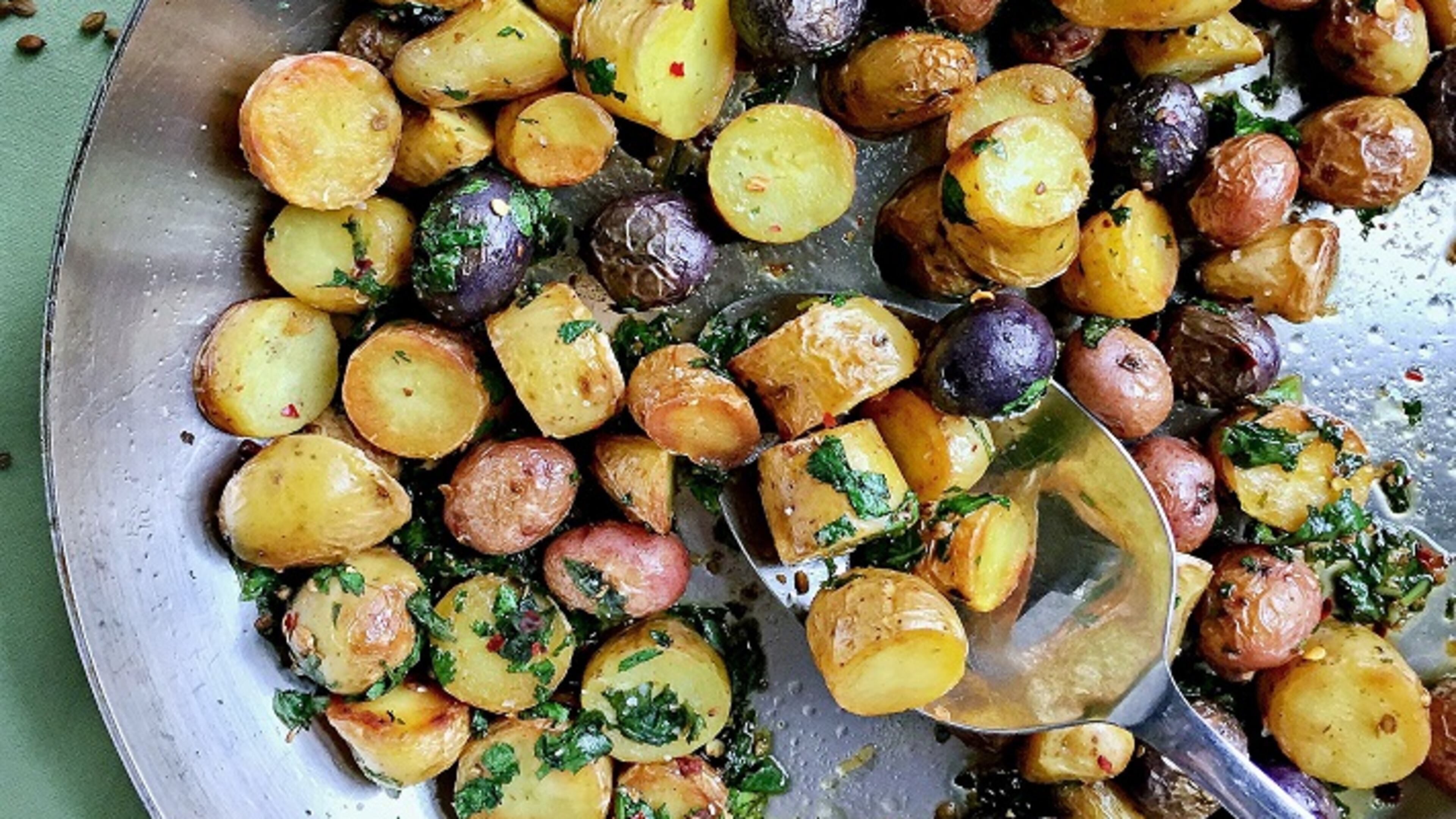 Fingerling potato salad topped with basil and made in a skillet. (Gretchen McKay/Pittsburgh Post-Gazette/TNS)