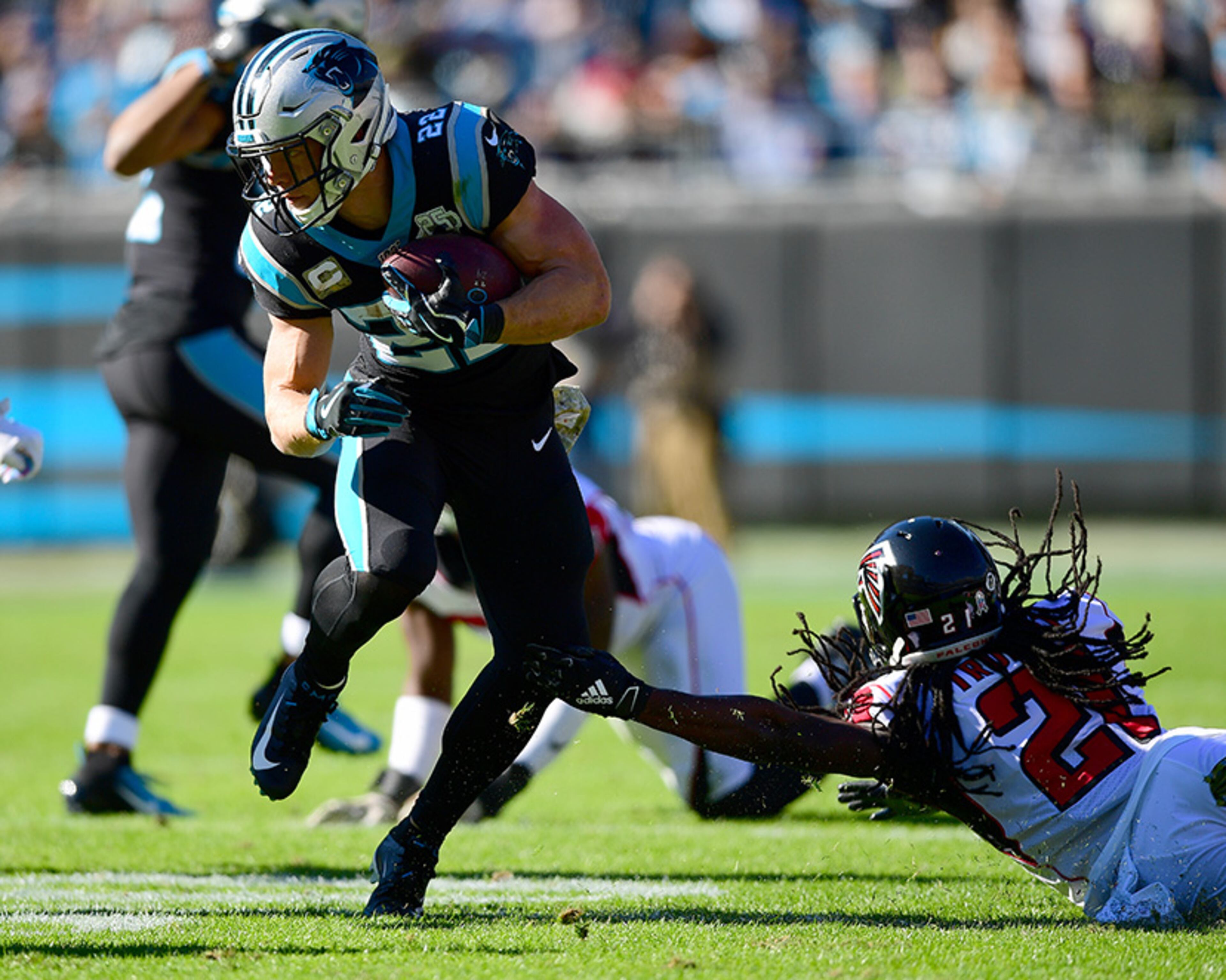 Carolina's Christian McCaffrey escapes the reach of a Falcons defender Sunday, Nov. 17, 2019, at Bank of America Stadium in Charlotte.