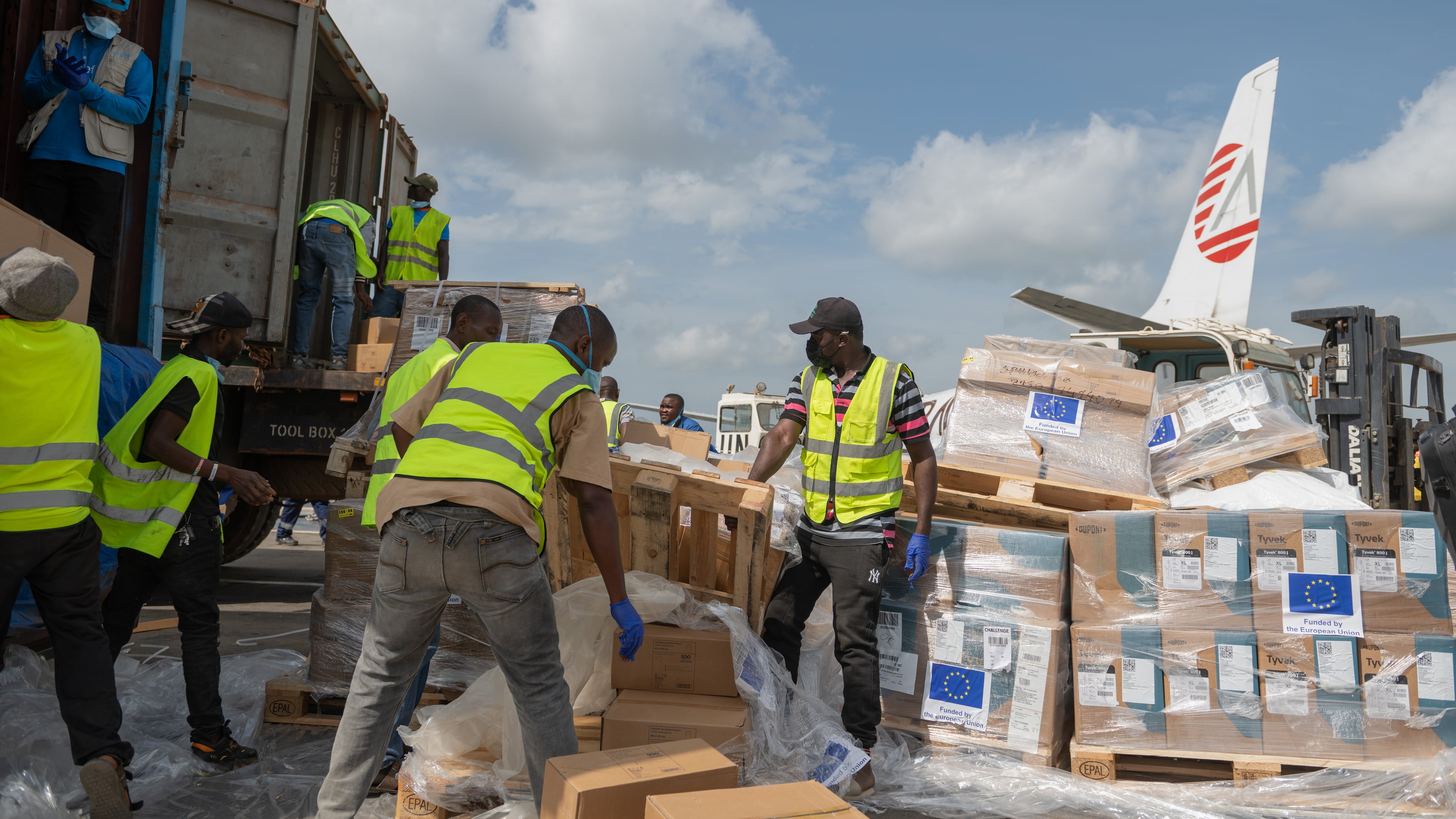 Workers offload medical and emergency supplies donated by European Union to support frontline workers in fighting Ebola upon arrival at the national airport in Bunia, Congo. Thursday, May 28, 2026. (AP Photo/Moses Sawasawa)