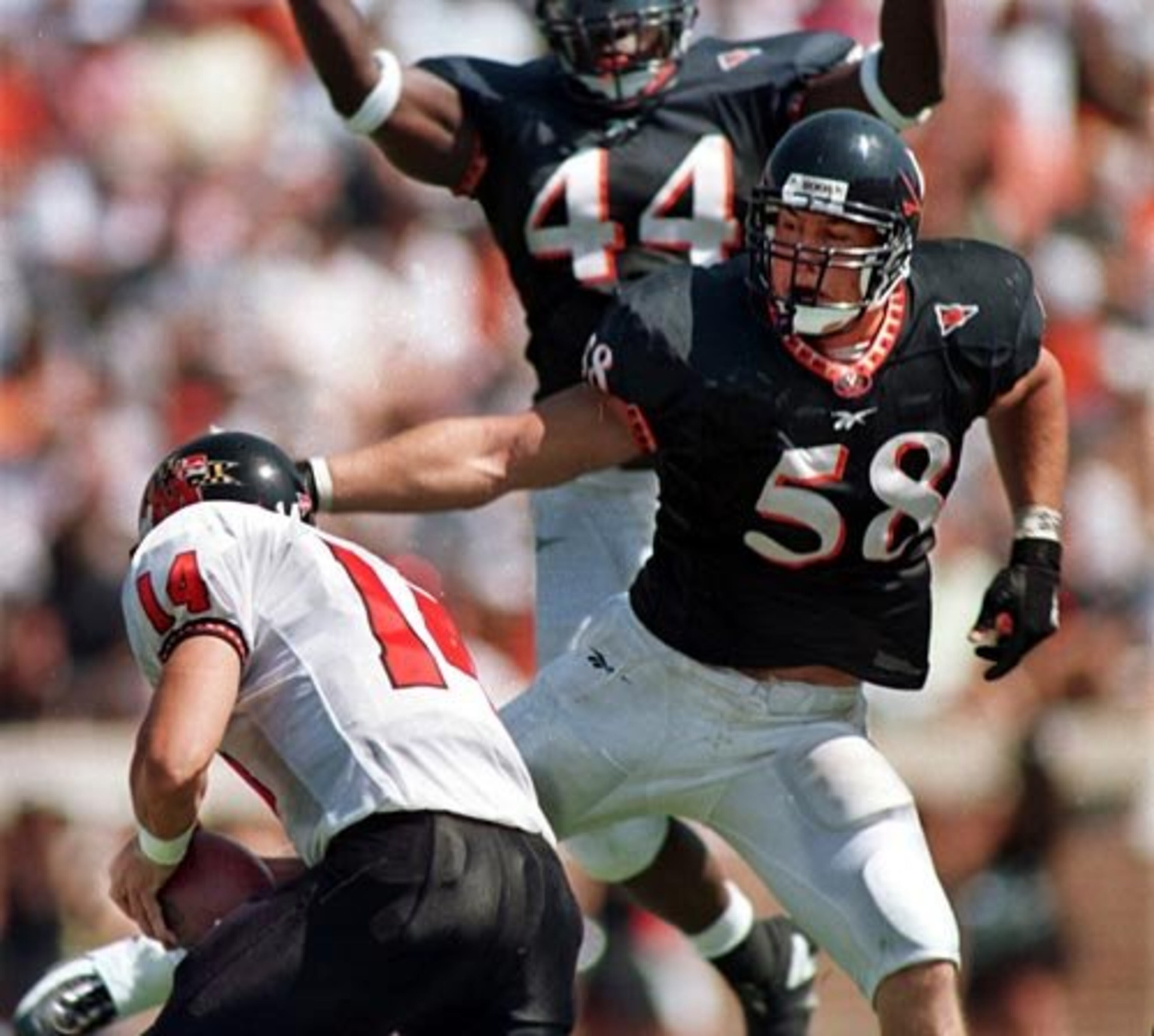 Kerney (58, right) was drafted by the Falcons in first round (30th overall) of the 1999 NFL draft out of Virginia. - D. Orlando Ledbetter, AJC