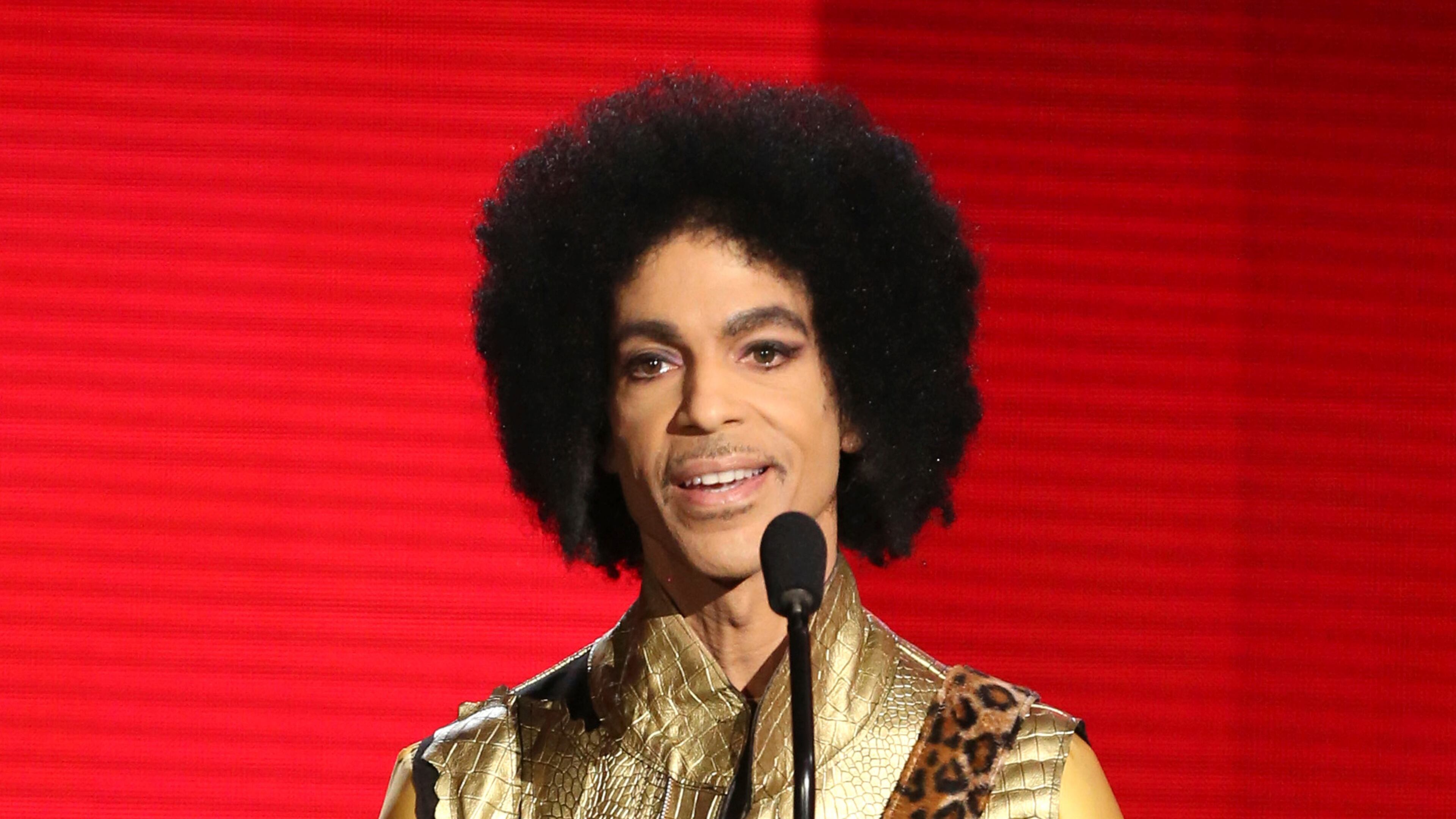 FILE - In this Nov. 22, 2015, file photo, Prince presents the award for favorite album - soul/R&B at the American Music Awards in Los Angeles. Prince died at his home in Chanhassen, Minn. on April 21, 2016 at the age of 57. (Photo by Matt Sayles/Invision/AP, File)