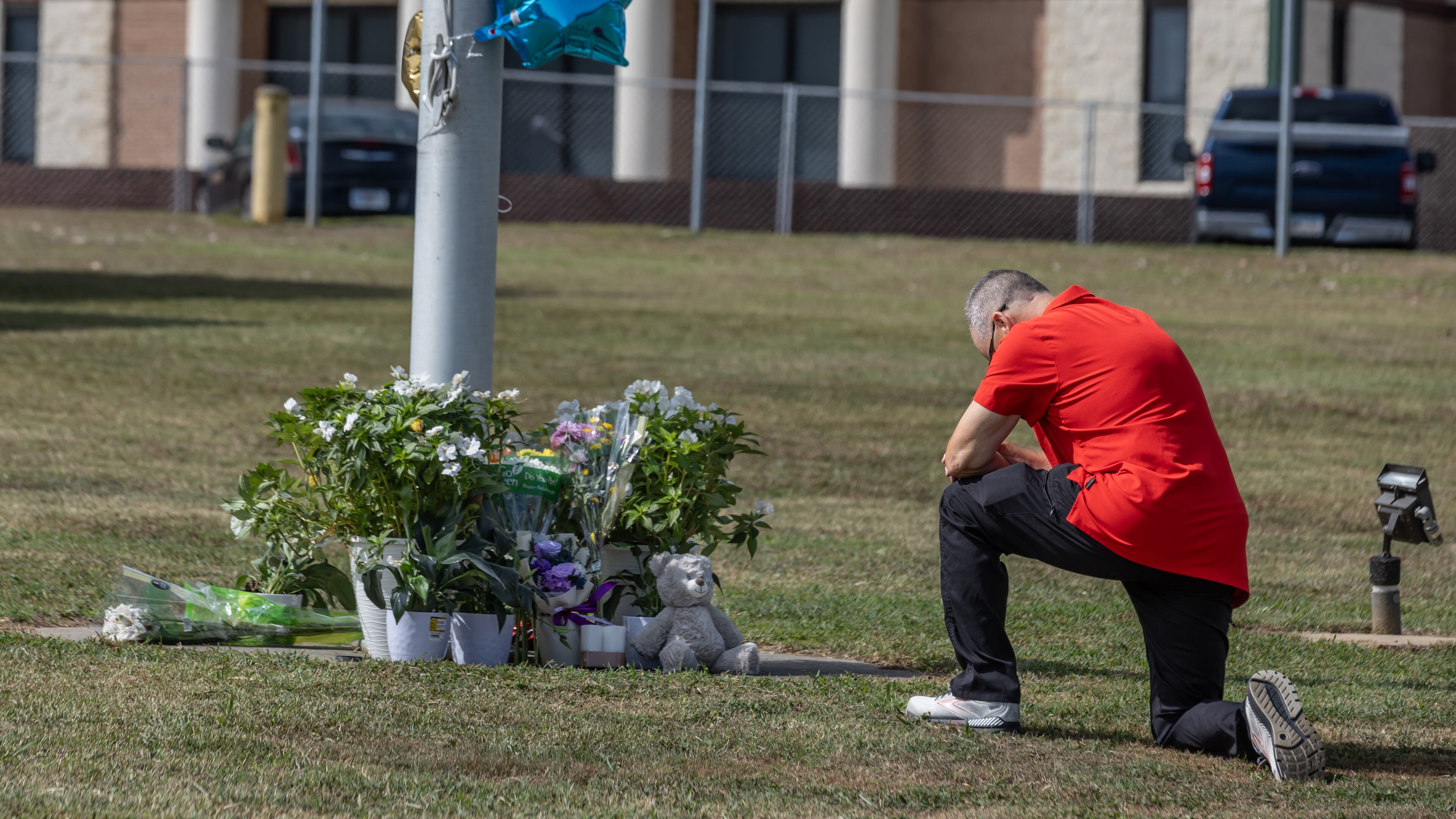 Students and well wishers arrived with flowers to place at the flag pole at Apalachee High School in Winder on Thursday, Sept. 5, 2024. Two students and two teachers killed in a shooting at the school a day earlier. (John Spink/AJC)