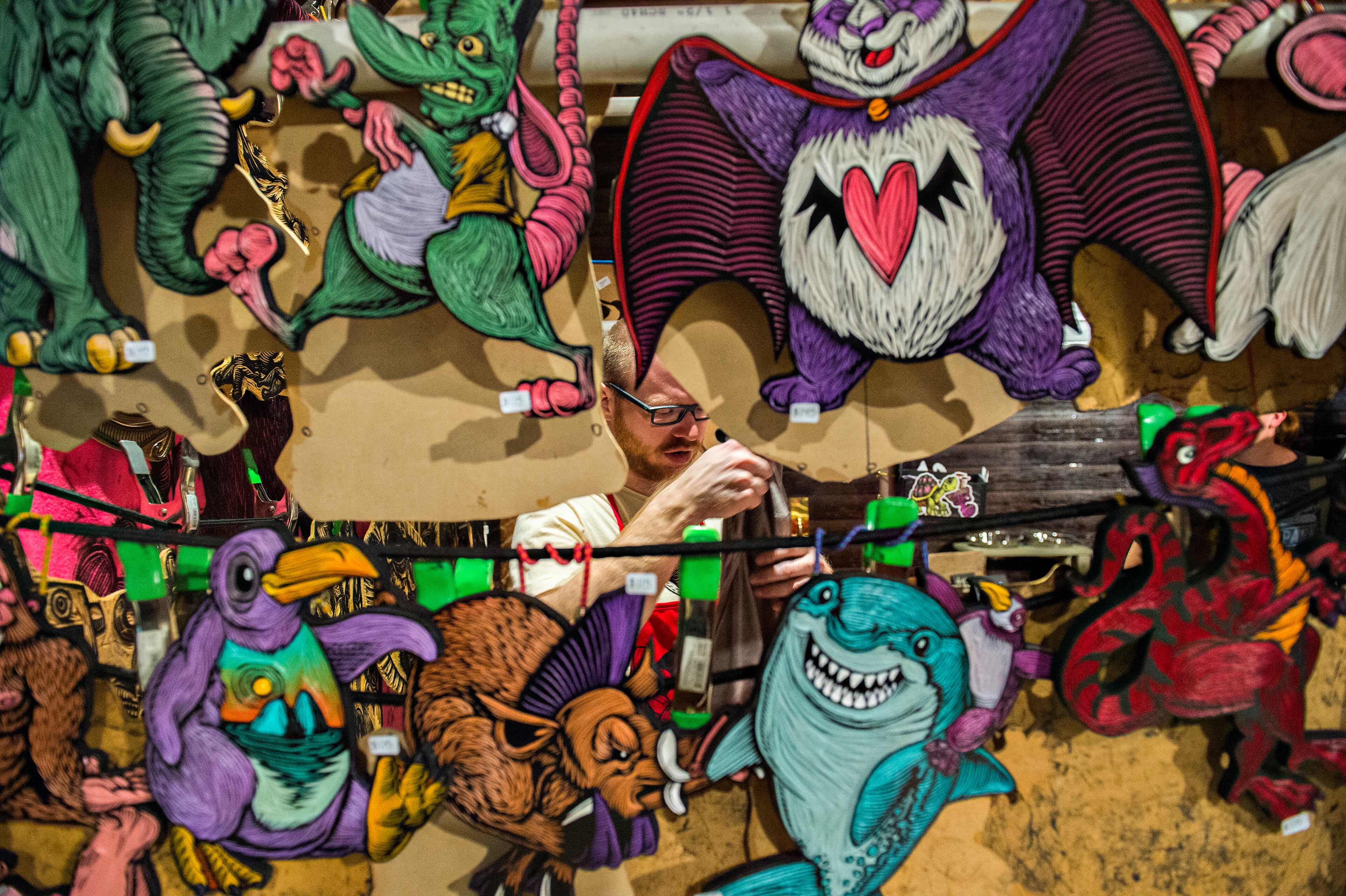 November 21, 2015 Atlanta - Chris Neuenschwander works in his booth during the Indie Craft Experience's Holiday Shopping Spectacular at the Georgia Freight Depot in Atlanta on Saturday, November 21, 2015. The 11th annual arts festival featured local and regional artists, food, music and holiday cheer. JONATHAN PHILLIPS / SPECIAL