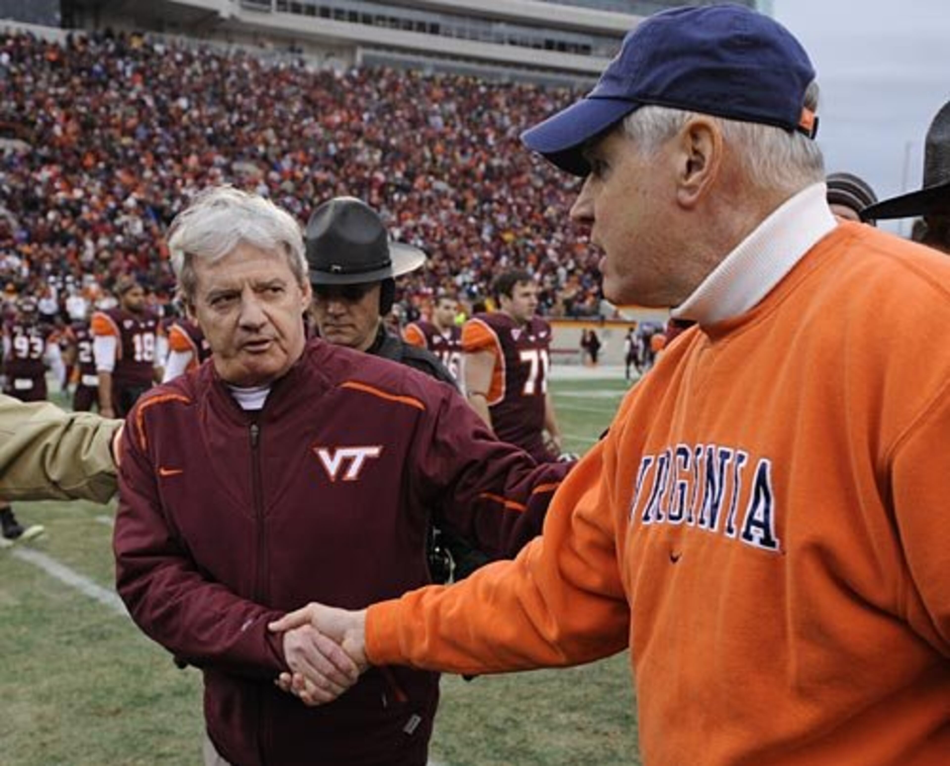 ESPN is reporting that after a long dance, Georgia Tech has signed former Virginia head coach Al Groh (right, with Virginia Tech coach Frank Beamer) to be its next defensive coordinator.