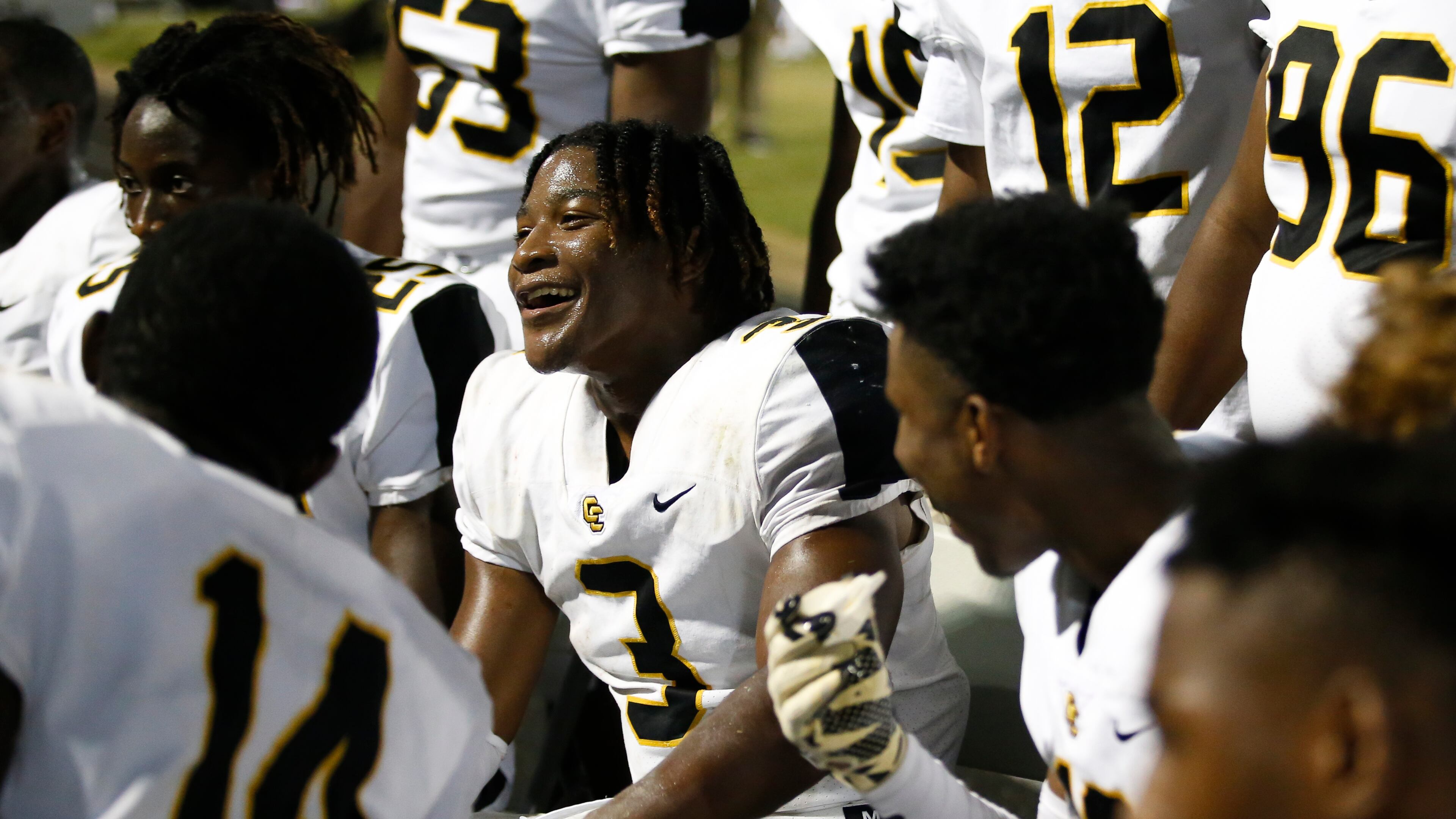 Colquitt County's Camari "Juicy" Louis (3) celebrates with teammates after nearly running his interception to the end zone during the first half of a high school football game between Grayson and Colquitt County at Grayson High School in Loganville, Ga., on Fri., Sept. 21, 2018. (Casey Sykes for The Atlanta Journal-Constitution)