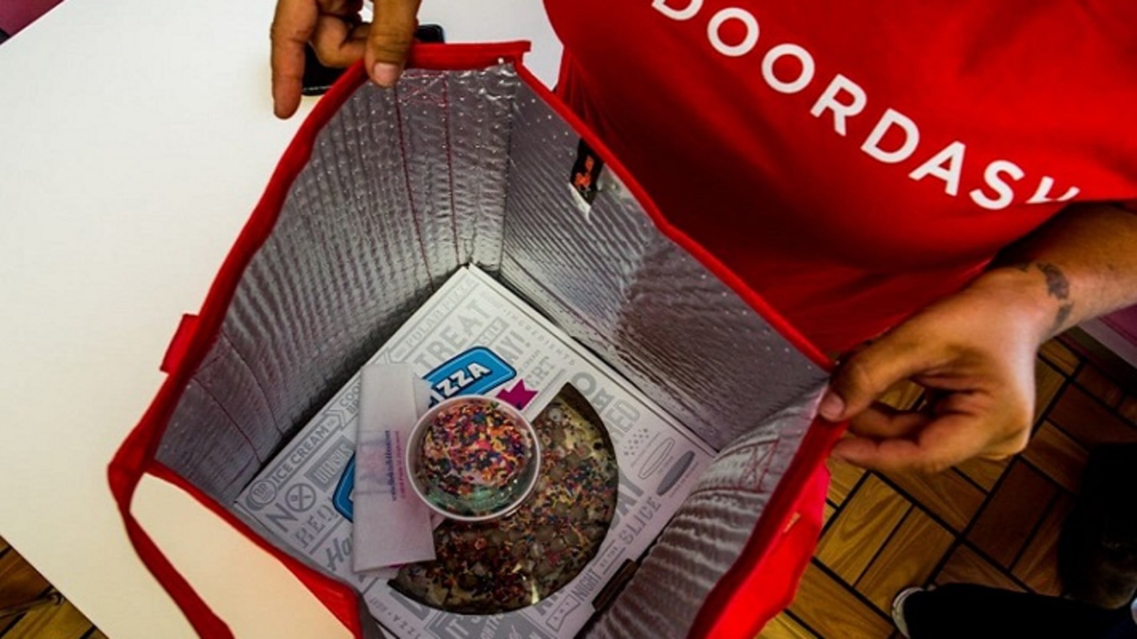 A DoorDash driver starts to bag up an order in Daly City, Calif. Cobb County students won't be able to take advantage of food delivery services moving forward, according to recently updated student conduct rules. (Christie Hemm Klok for The Washington Post)