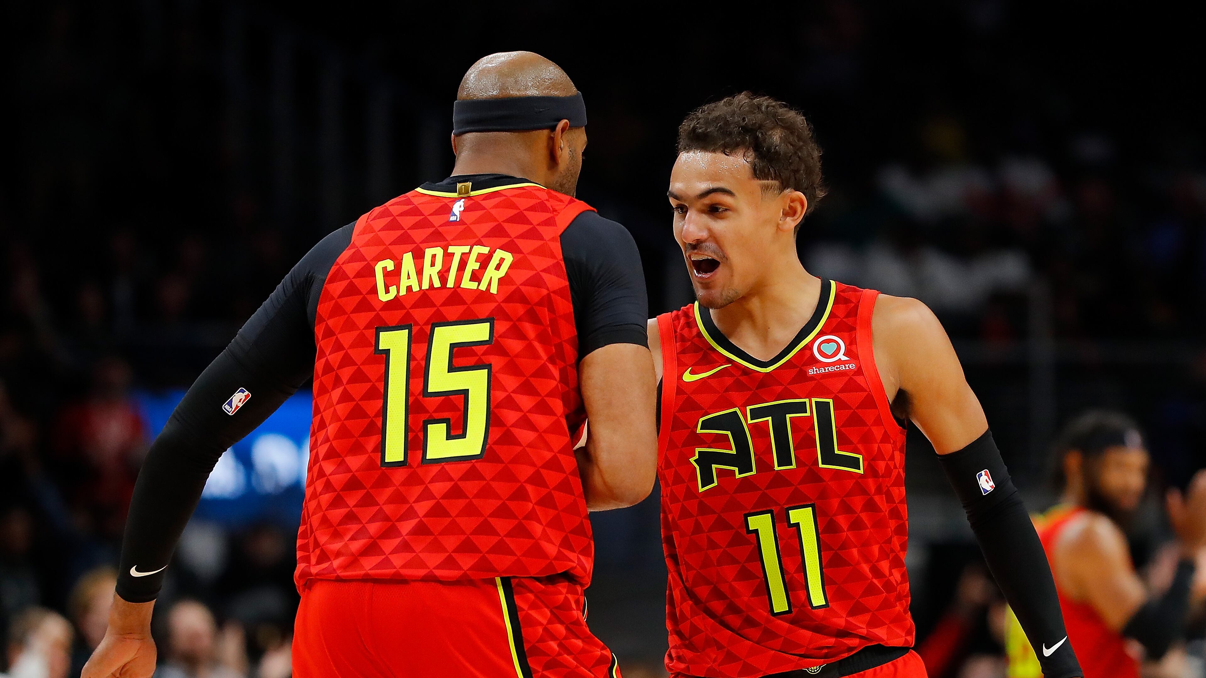 Trae Young #11 of the Atlanta Hawks celebrates after a shot by Vince Carter #15 in the second half against the San Antonio Spurs. (Photo by Kevin C. Cox/Getty Images)