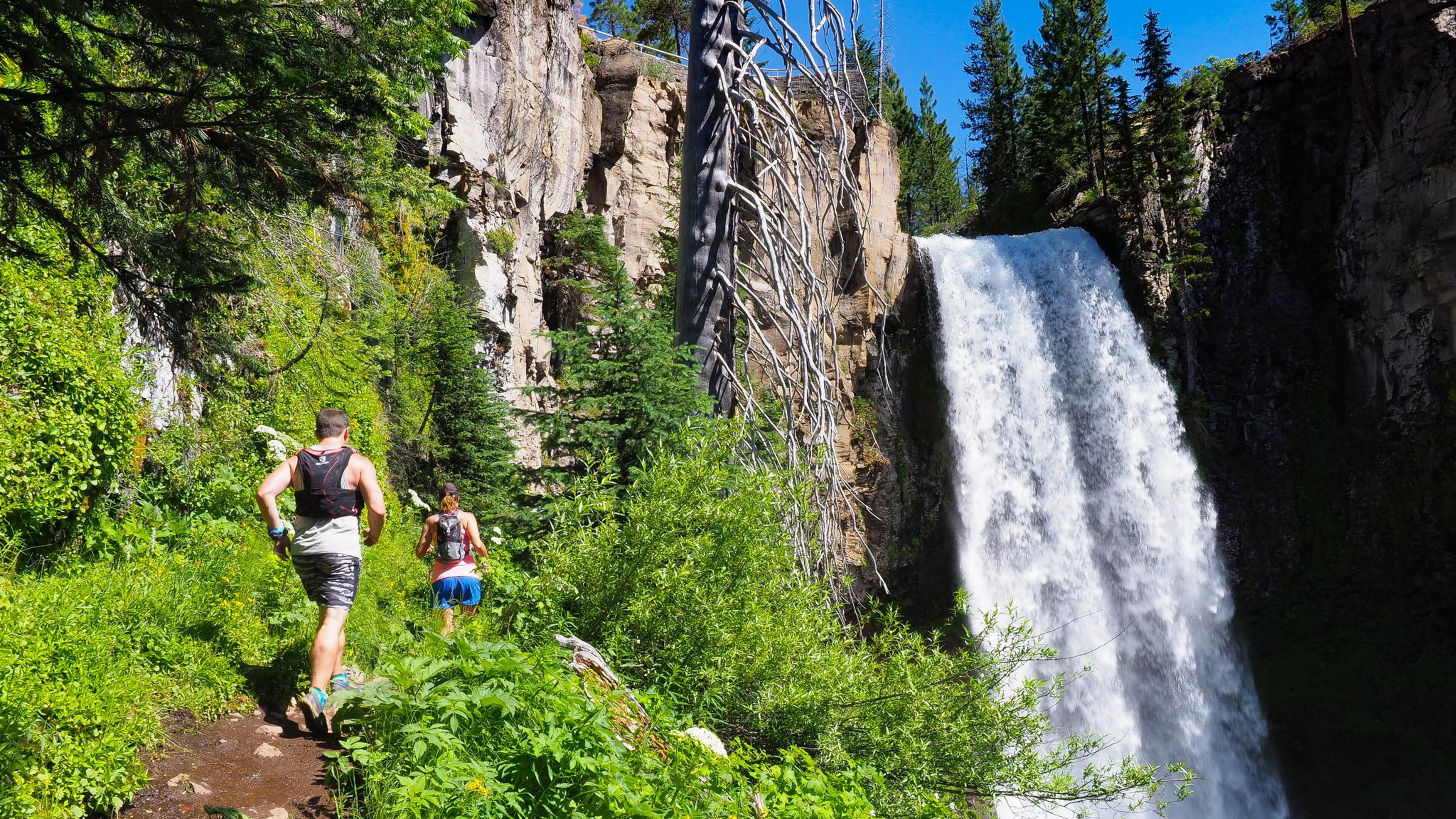 Runners make their way toward Tumalo Falls during a Rogue Expeditions trip to Bend, Ore., in July. Pam LeBlanc/American-Statesman