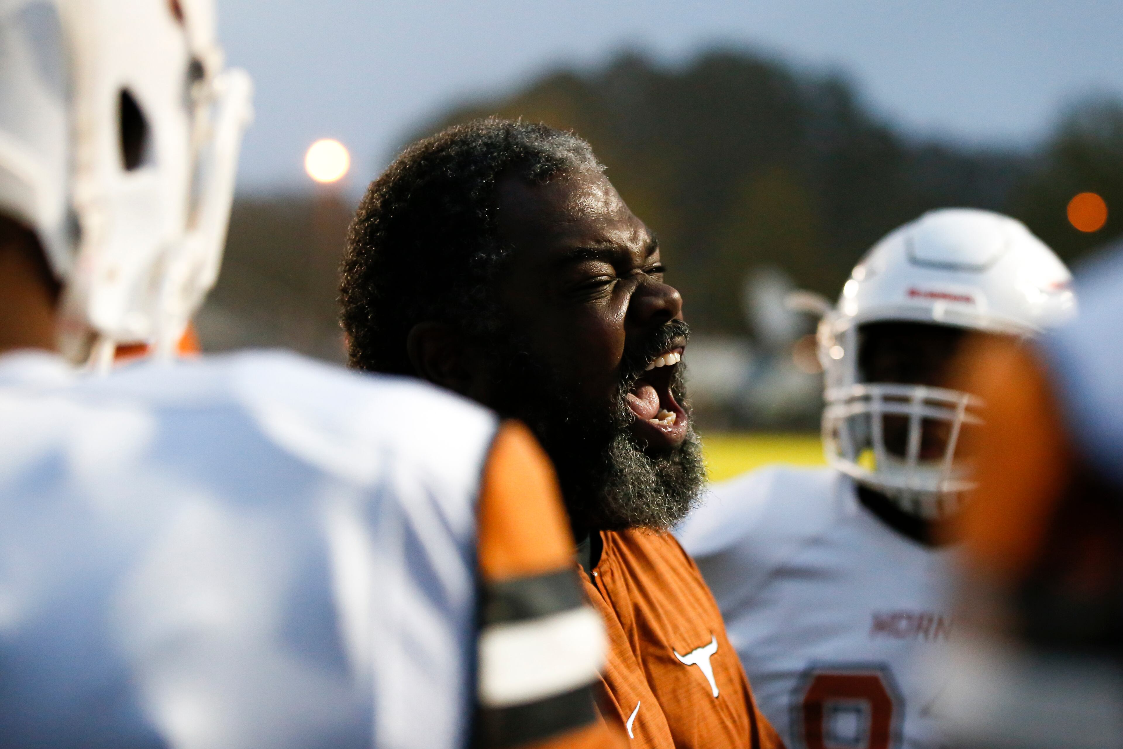 Lanier defensive line coach Daryl Beard gets his team fired up before the start of a high school football game between Lanier and Dacula at Dacula High School in Dacula, Ga., on Friday, Oct. 26, 2018. (Casey Sykes for The Atlanta Journal-Constitution)