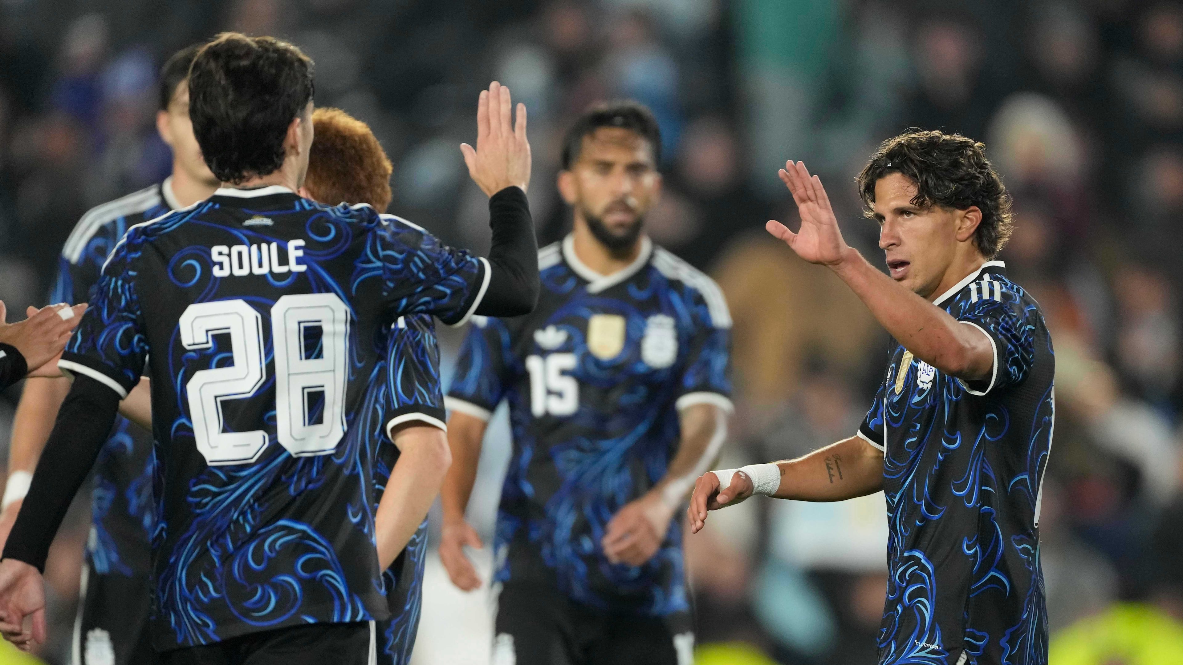 Argentina's Giuliano Simeone, right, celebrates with teammates after scoring his side's seventh goal against Burkina Faso during an international friendly soccer match in Buenos Aires, Argentina, Saturday, Oct. 3, 2026. (AP Photo/Gustavo Garello)