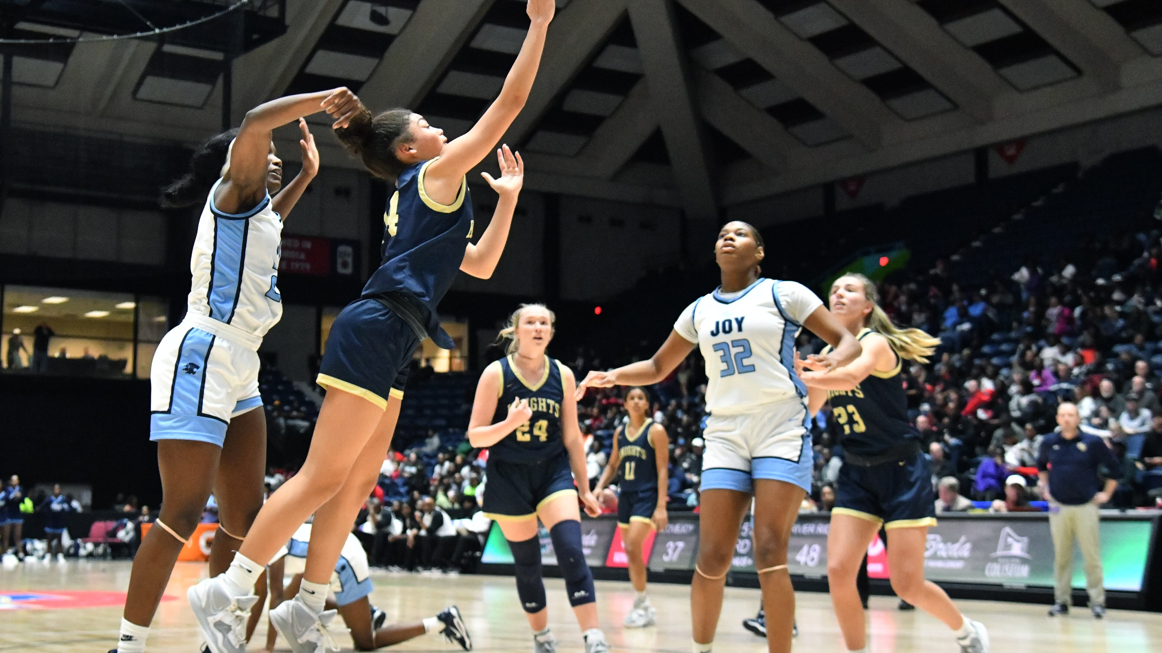 River Ridge's Makayla Roberson (14) gets a shot off past Lovejoy's La’nya Foster (left) during 2023 GHSA Basketball Class 6A Girl’s State Championship game at the Macon Centreplex, Friday, March 10, 2023, in Macon, GA. River Ridge won 68-50 over Lovejoy. (Hyosub Shin / Hyosub.Shin@ajc.com)