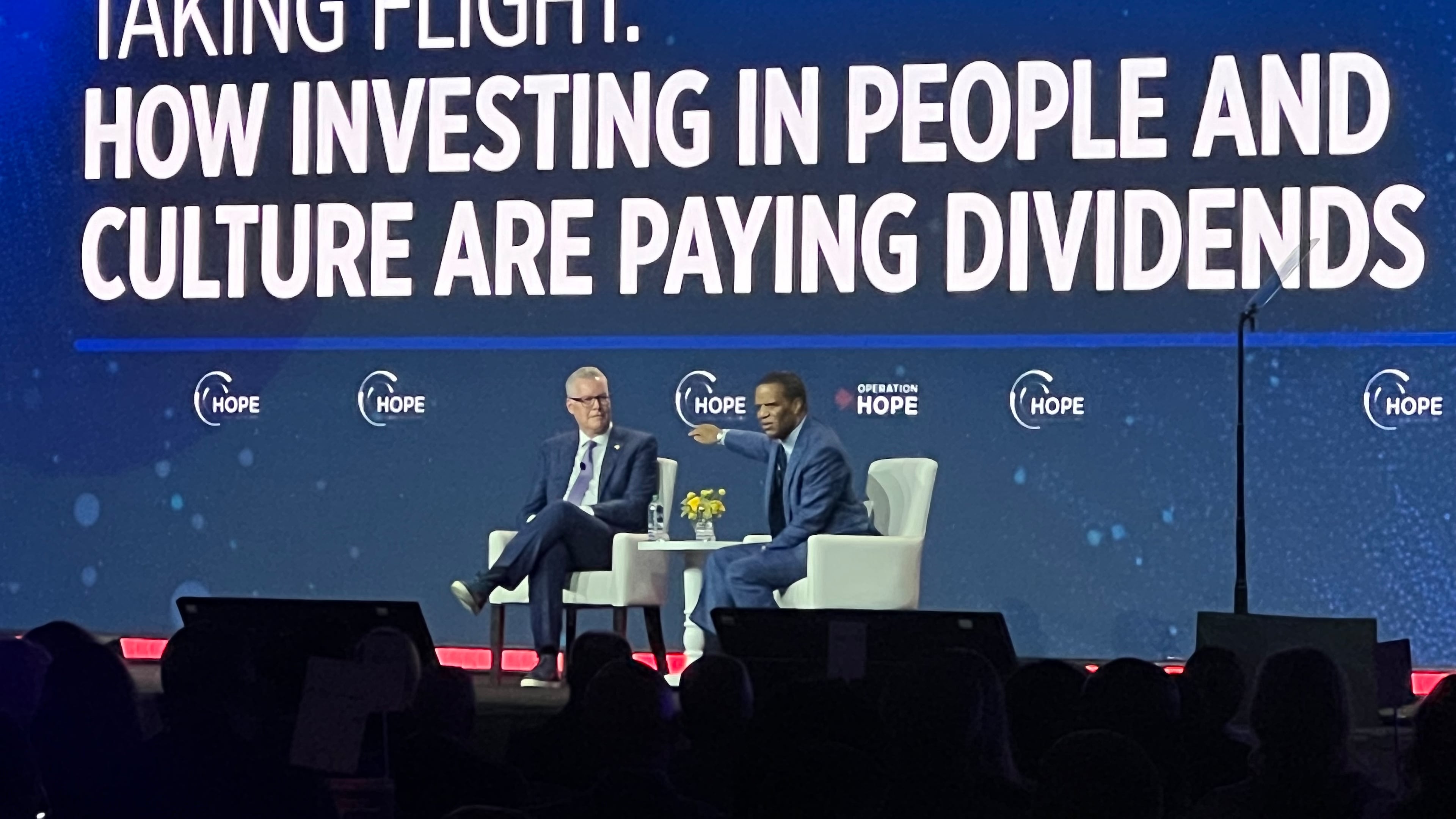 Delta CEO Ed Bastian speaks on stage with Operation HOPE CEO John Hope Bryant at the 2023 HOPE Global Forum.