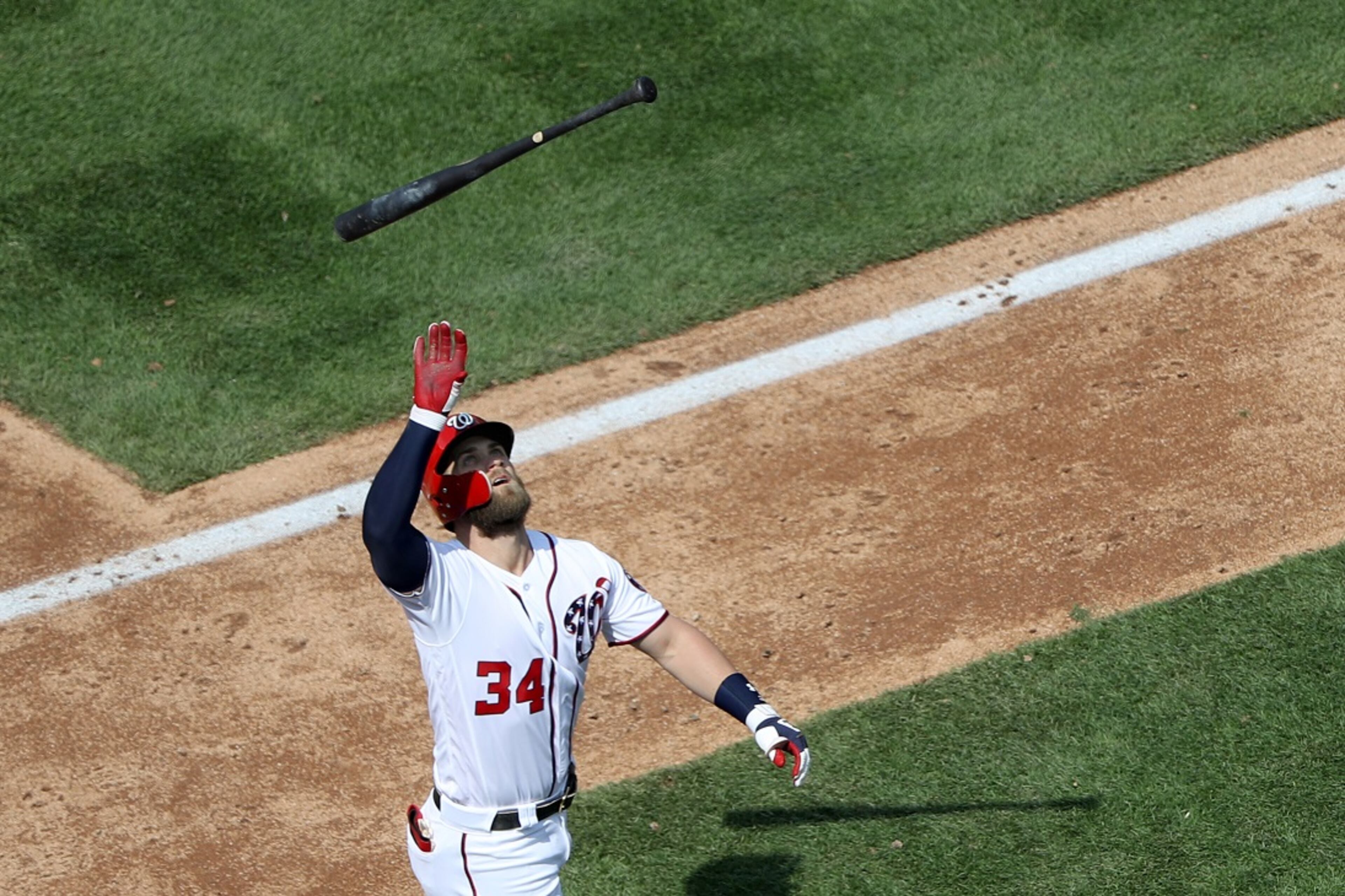 WASHINGTON, DC - APRIL 11: Bryce Harper #34 of the Washington Nationals flips his bat after hitting into a double play against the Atlanta Braves in the sixth inning at Nationals Park on April 11, 2018 in Washington, DC. (Photo by Rob Carr/Getty Images)