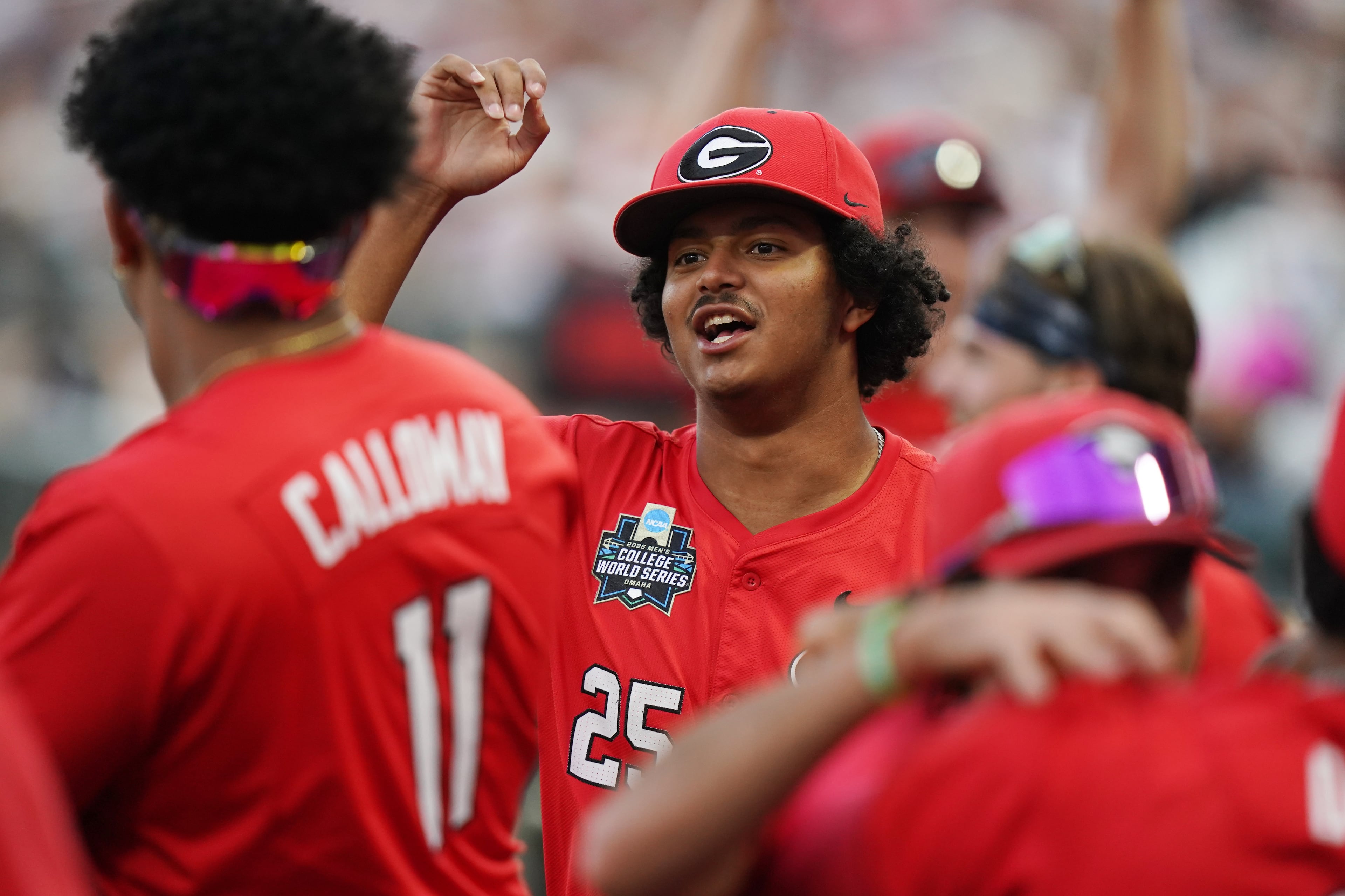 Georgia teammates react in the dugout after a run is scored in the fifth inning during an NCAA baseball College World Series elimination game against Texas, Tuesday, June 16, 2026 in Omaha, Neb. Georgia won 2-0. (AP Photo/Vera Nieuwenhuis)