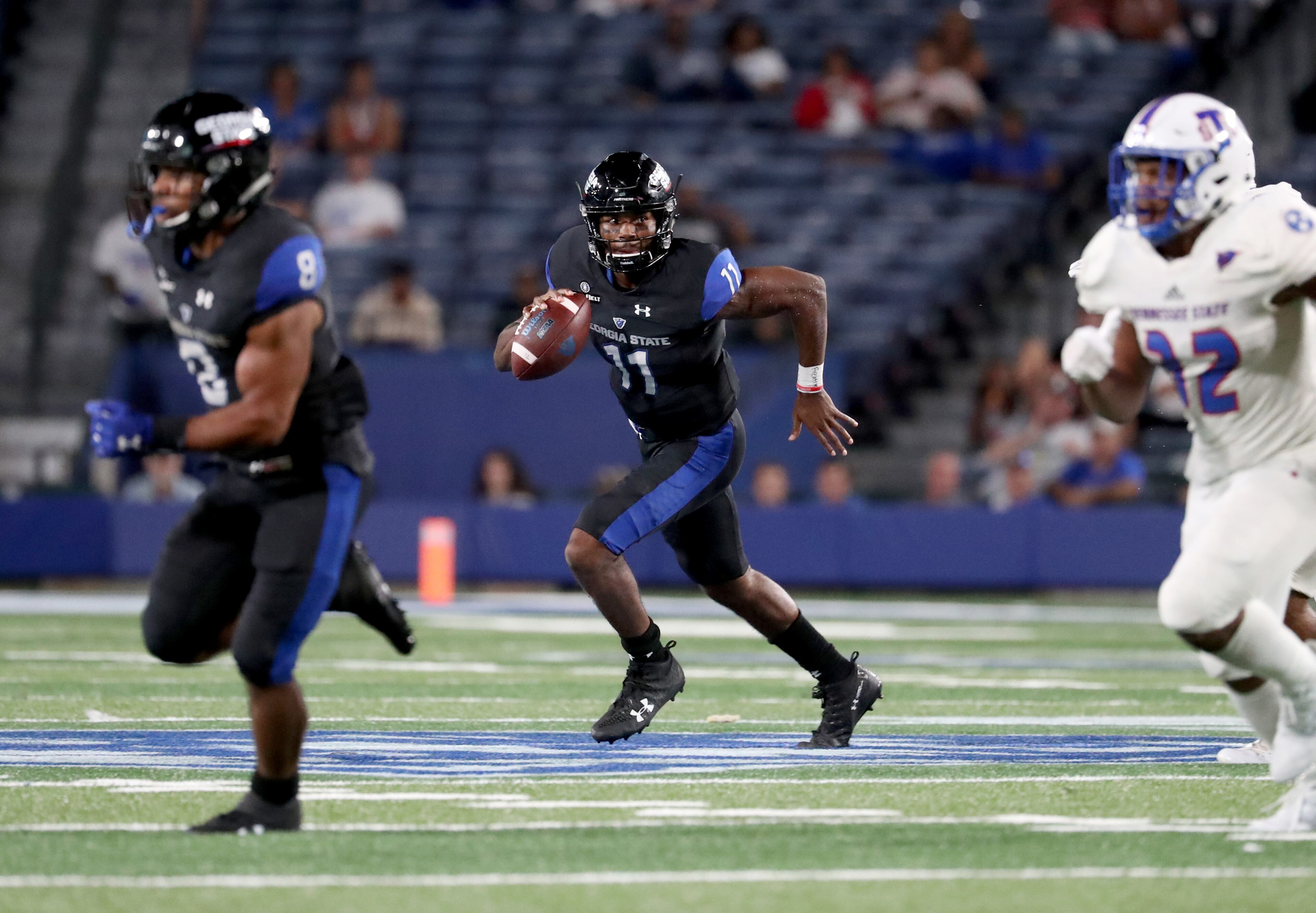 Georgia State Panthers quarterback Aaron Winchester (11) carries the ball against the Tennessee State Tigers during the second half at Georgia State Stadium Thursday in Atlanta, Ga., August 31, 2017. PHOTO / JASON GETZ