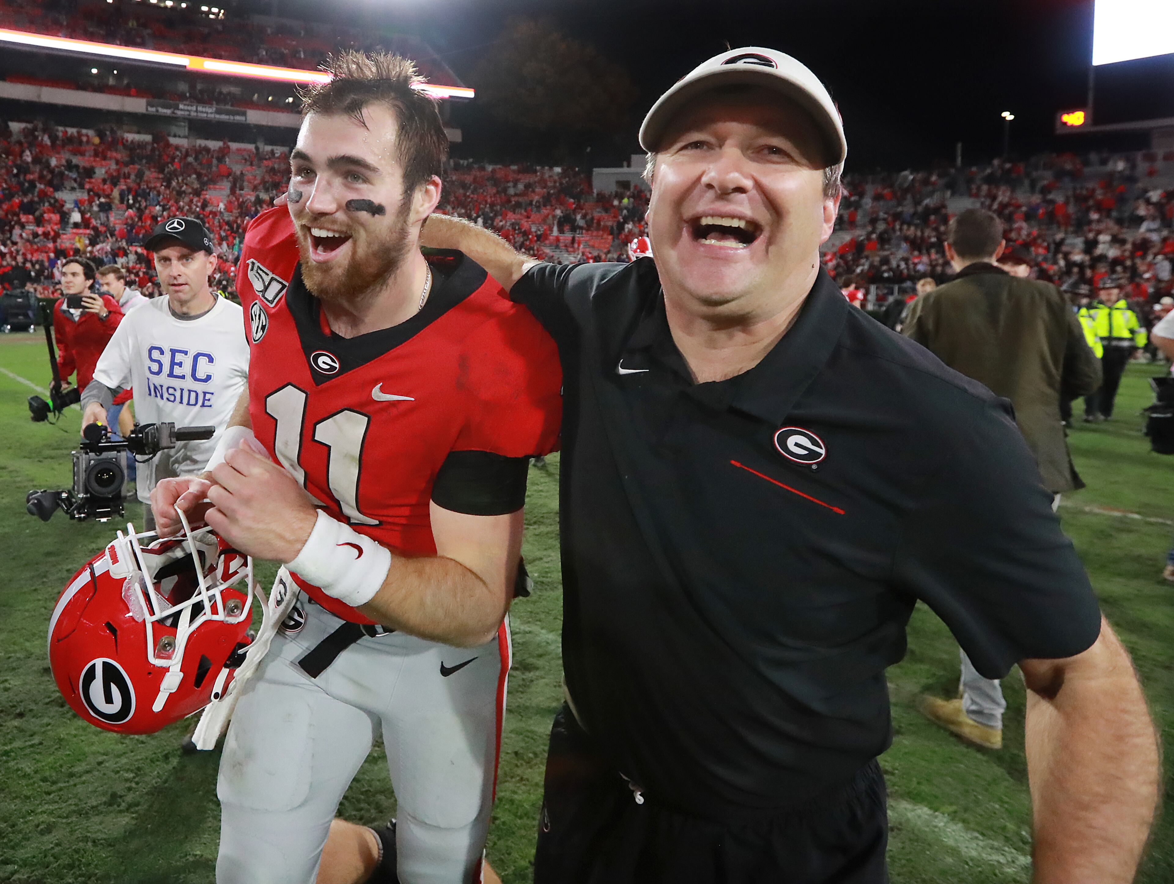 Georgia head coach Kirby Smart and quarterback Jake Fromm celebrate beating Texas A&M 19-13 in an NCAA college football game on Saturday, November 23, 2019, in Athens. Curtis Compton/ccompton@ajc.com