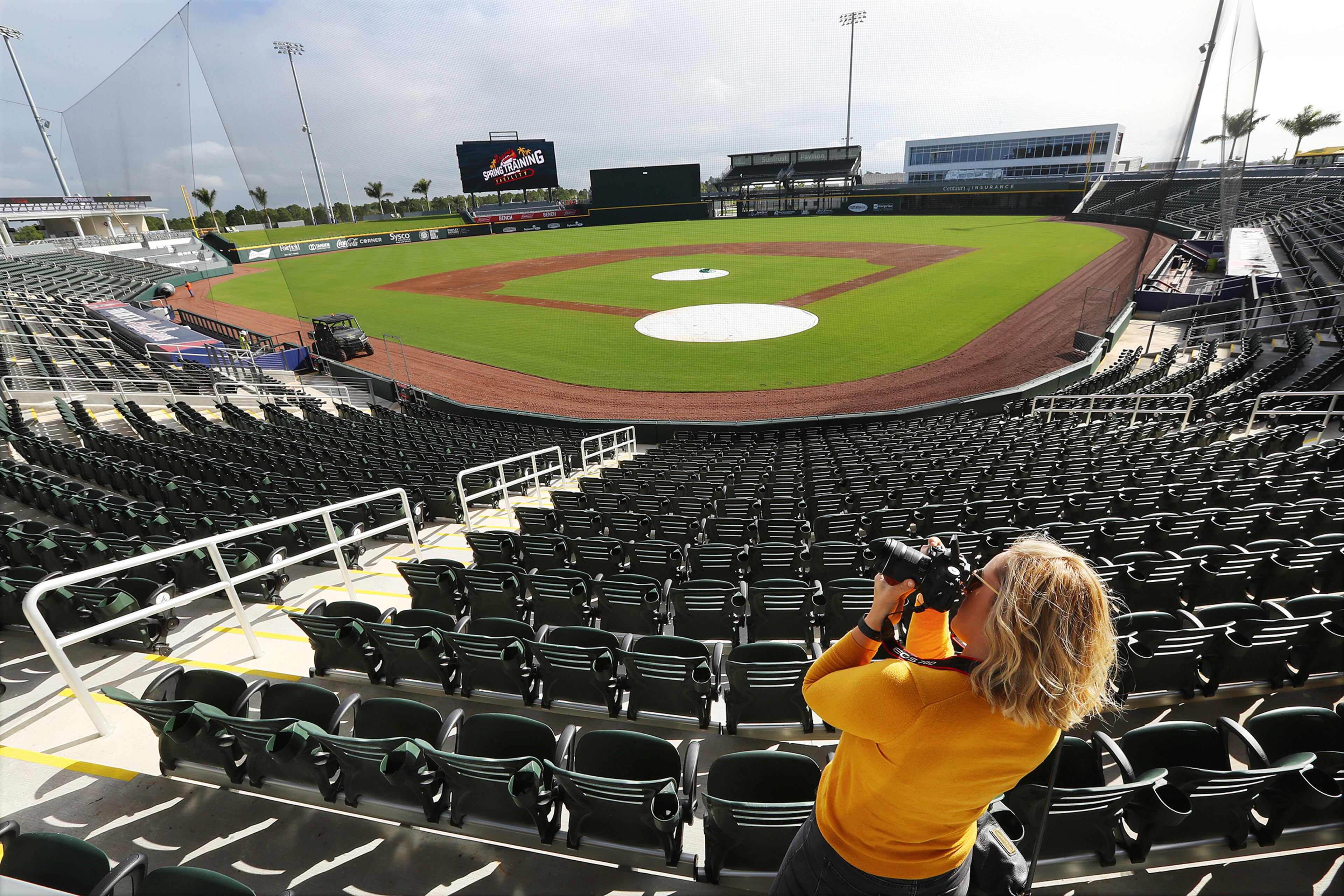Madison Heid takes a picture of the 6,200 seat, 1800 general admission/berm seating CoolToday Park. (Curtis Compton/ccompton@ajc.com).