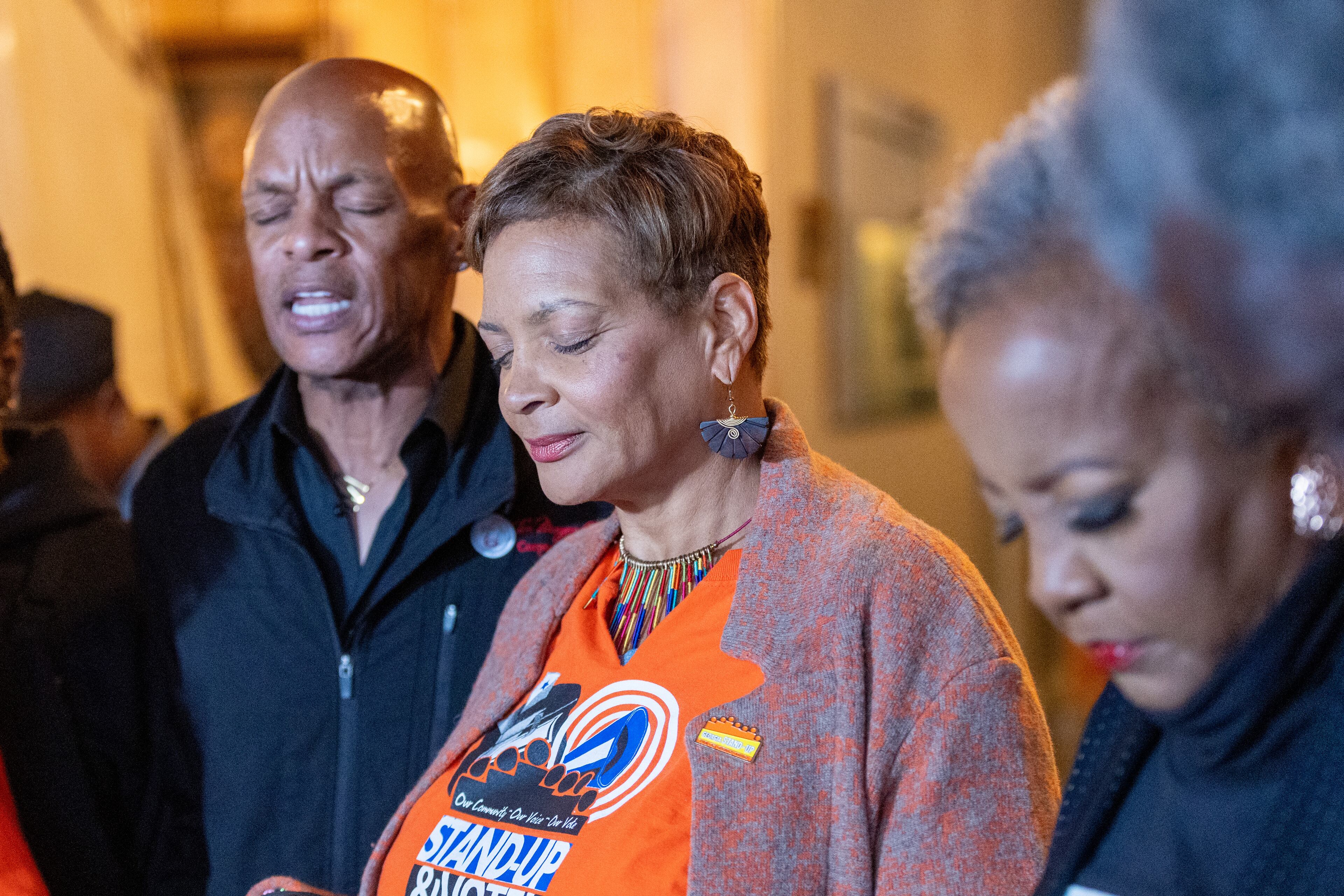 Chef Tim Morgan (Left) says a prayer before the 1200 hot meals he helped to prepare with Hosea Helps is delivered to people around Atlanta on Thursday, Nov. 23, 2023. (Steve Schaefer/steve.schaefer@ajc.com)