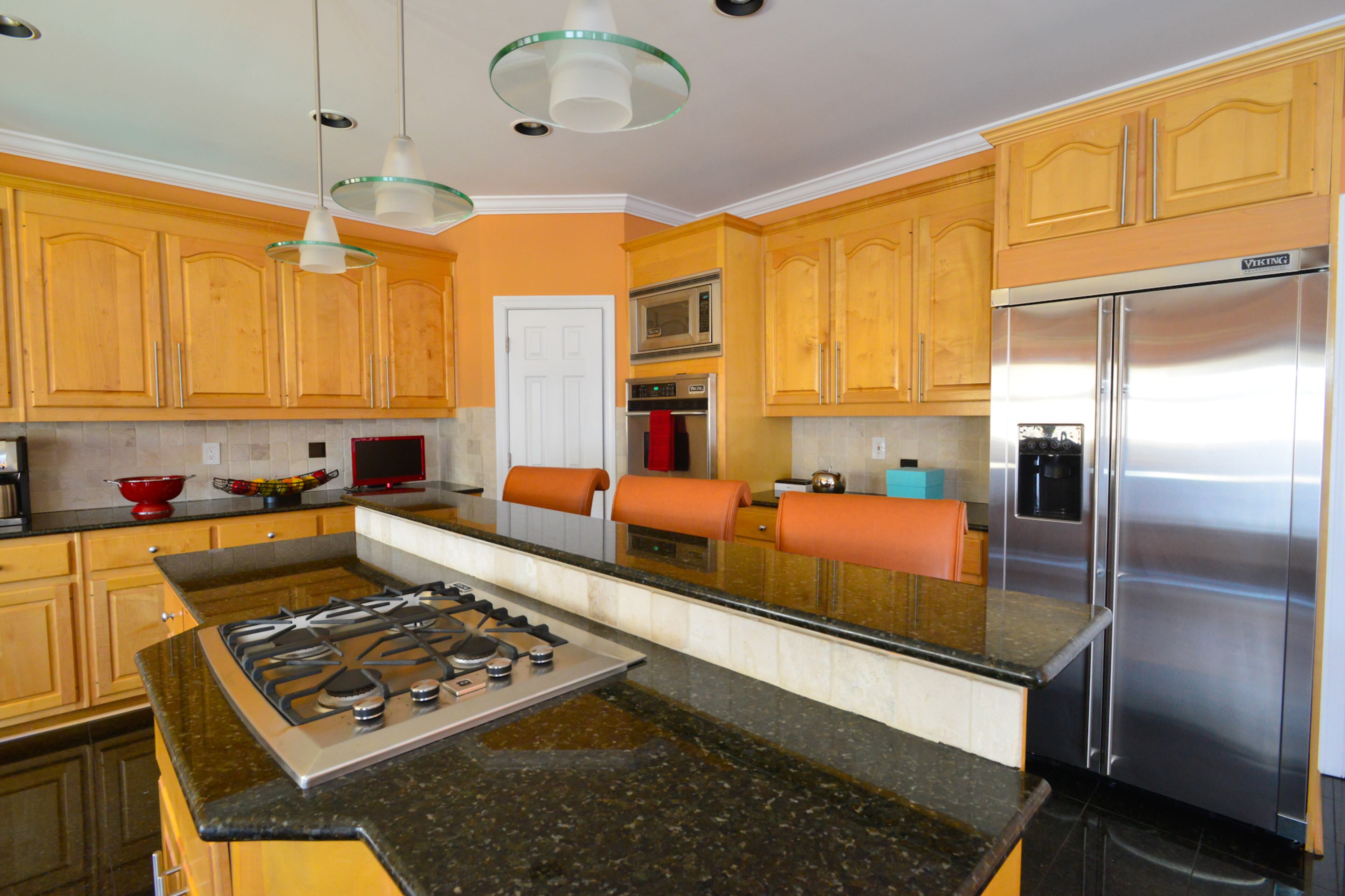 Shawn Evans Mitchell says the oversized kitchen is a favorite spot, especially to create kitchen memories cooking and baking with her teenage daughter, Maya. The kitchen features Viking Professional Series appliances.