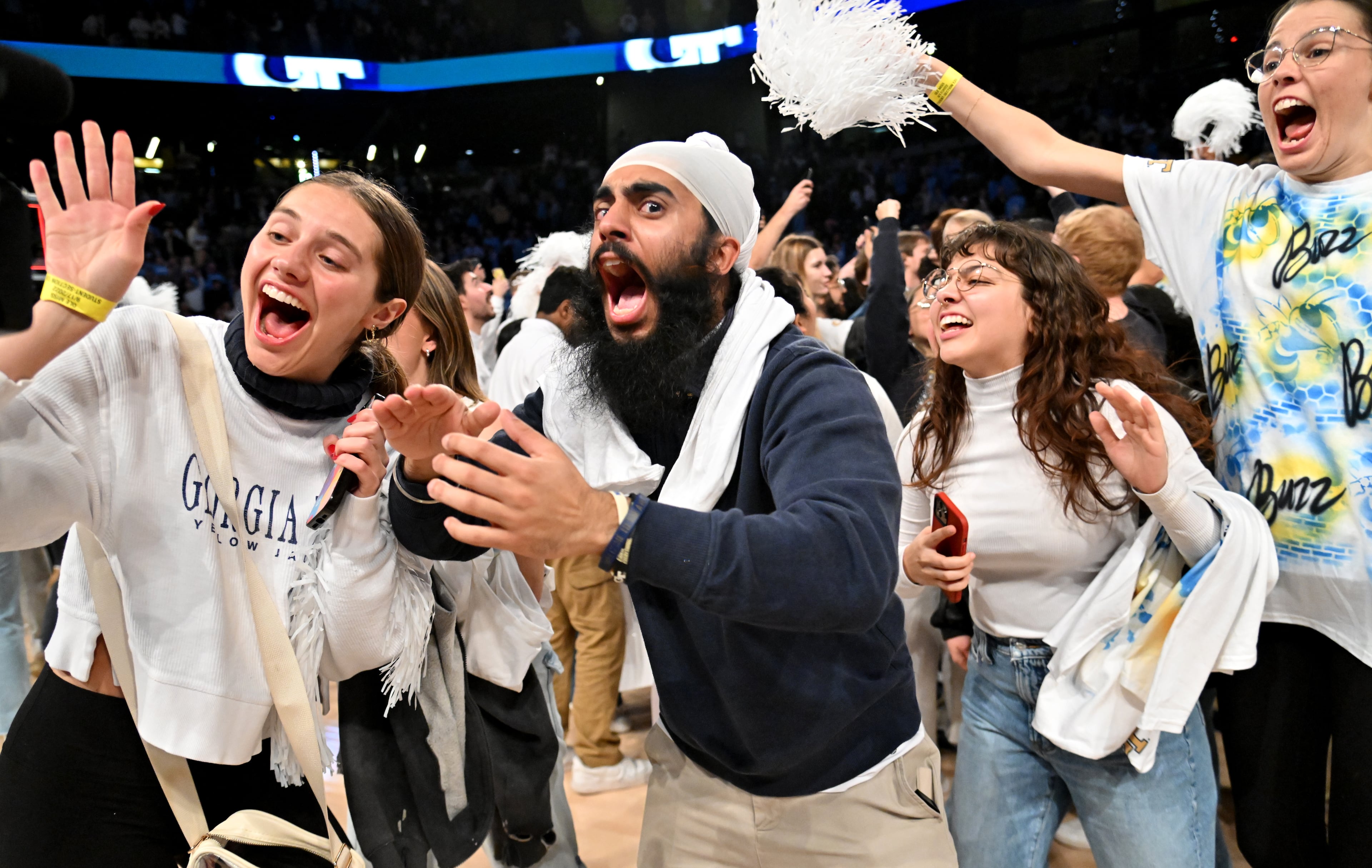 Fans storm the court as Georgia Tech celebrates the victory over North Carolina in an NCAA college basketball game at Georgia Tech’s McCamish Pavilion, Tuesday, January 30, 2024, in Atlanta. Georgia Tech won 74-73 over North Carolina. (Hyosub Shin / Hyosub.Shin@ajc.com)