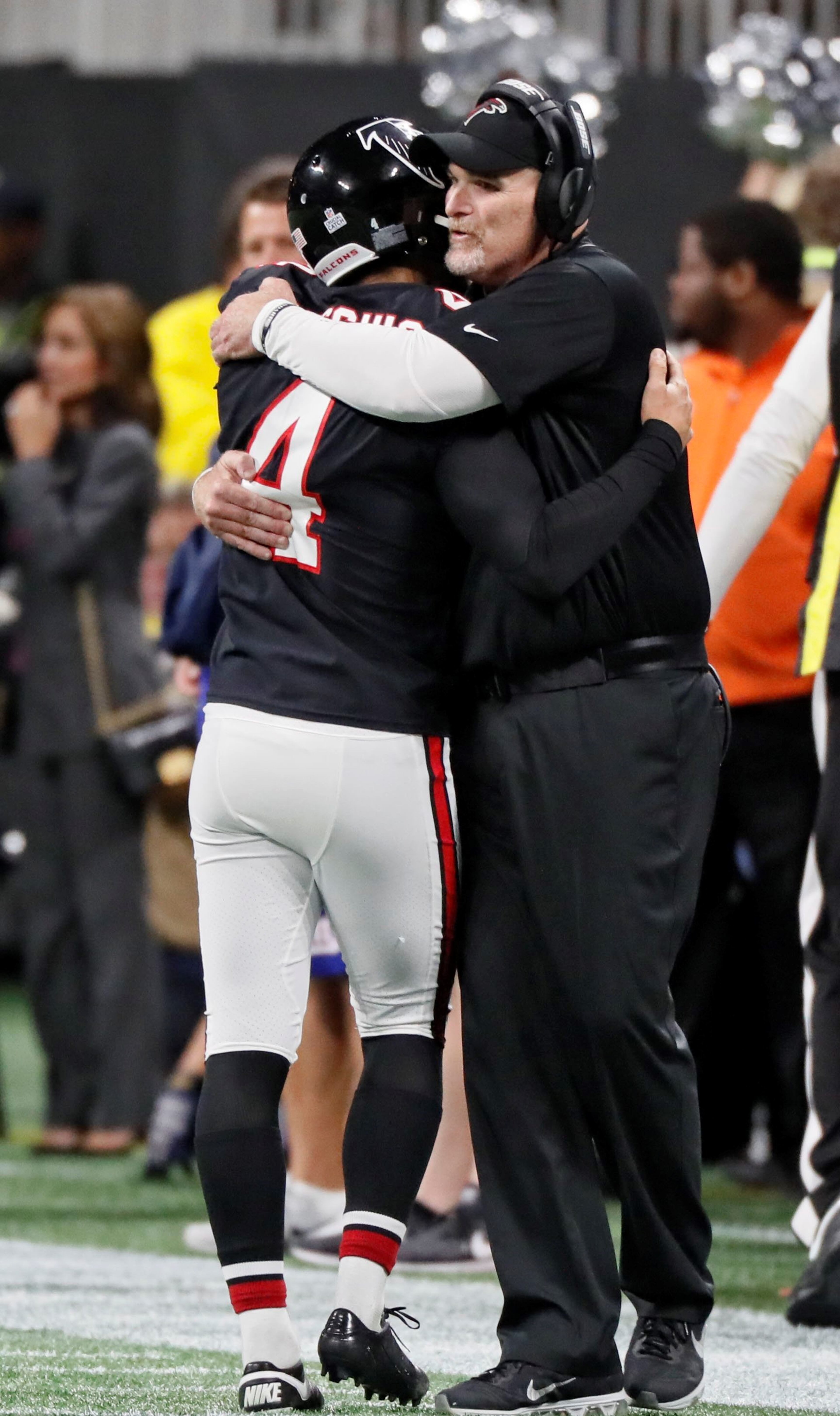 10/22/18 - Atlanta - Falcons coach Dan Quinn congratulates Atlanta Falcons kicker Giorgio Tavecchio (4) after his third field goal in the fourth quarter. The Atlanta Falcons played the New York Giants in an NFL football game Monday, October 22, 2018, at Mercedes-Benz Stadium in Atlanta, GA. BOB ANDRES / BANDRES@AJC.COM