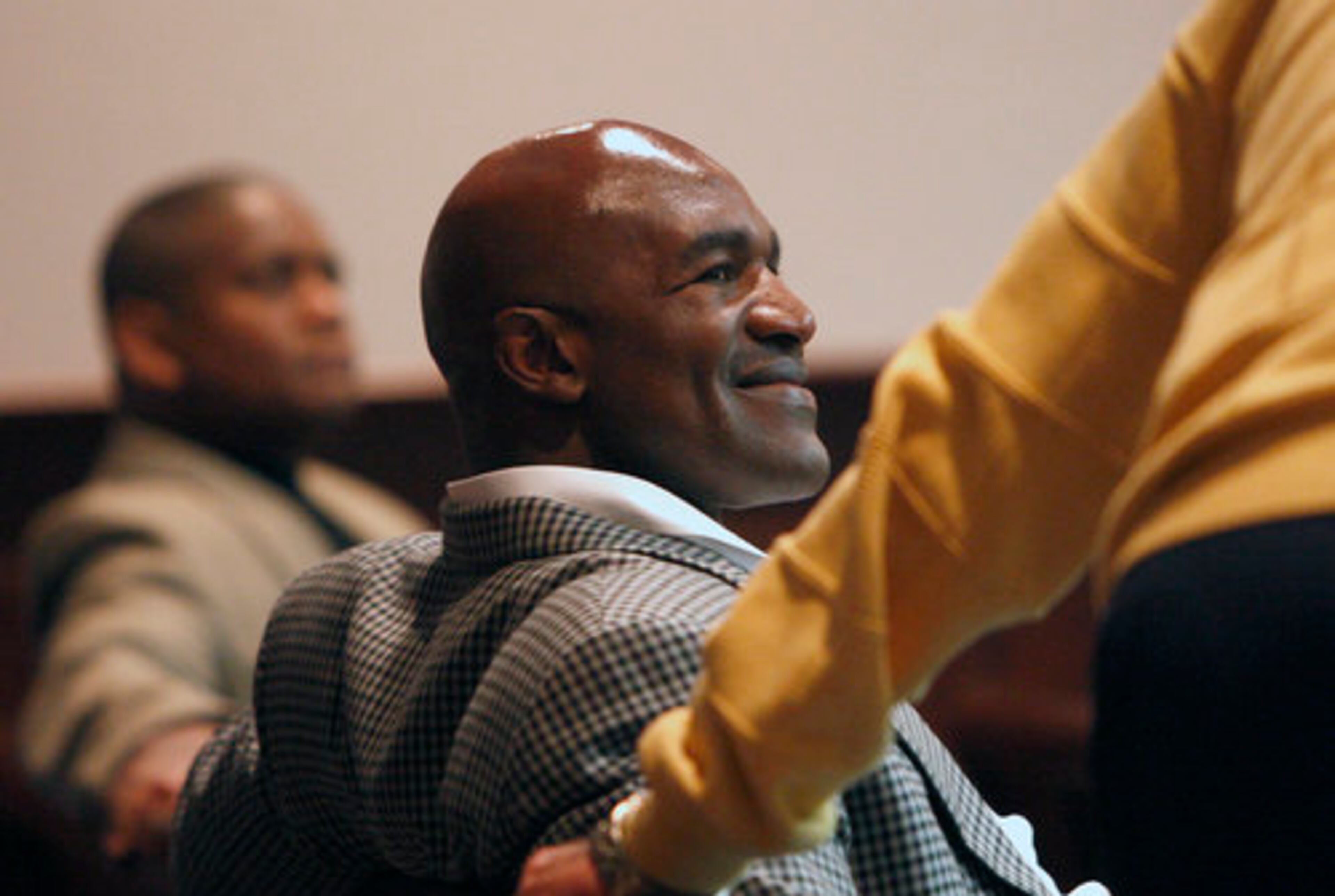 Former heavyweight boxing champion Evander Holyfield smiles as he greeted before the start of court inside a Fayette County Superior Courtroom on Wednesday,