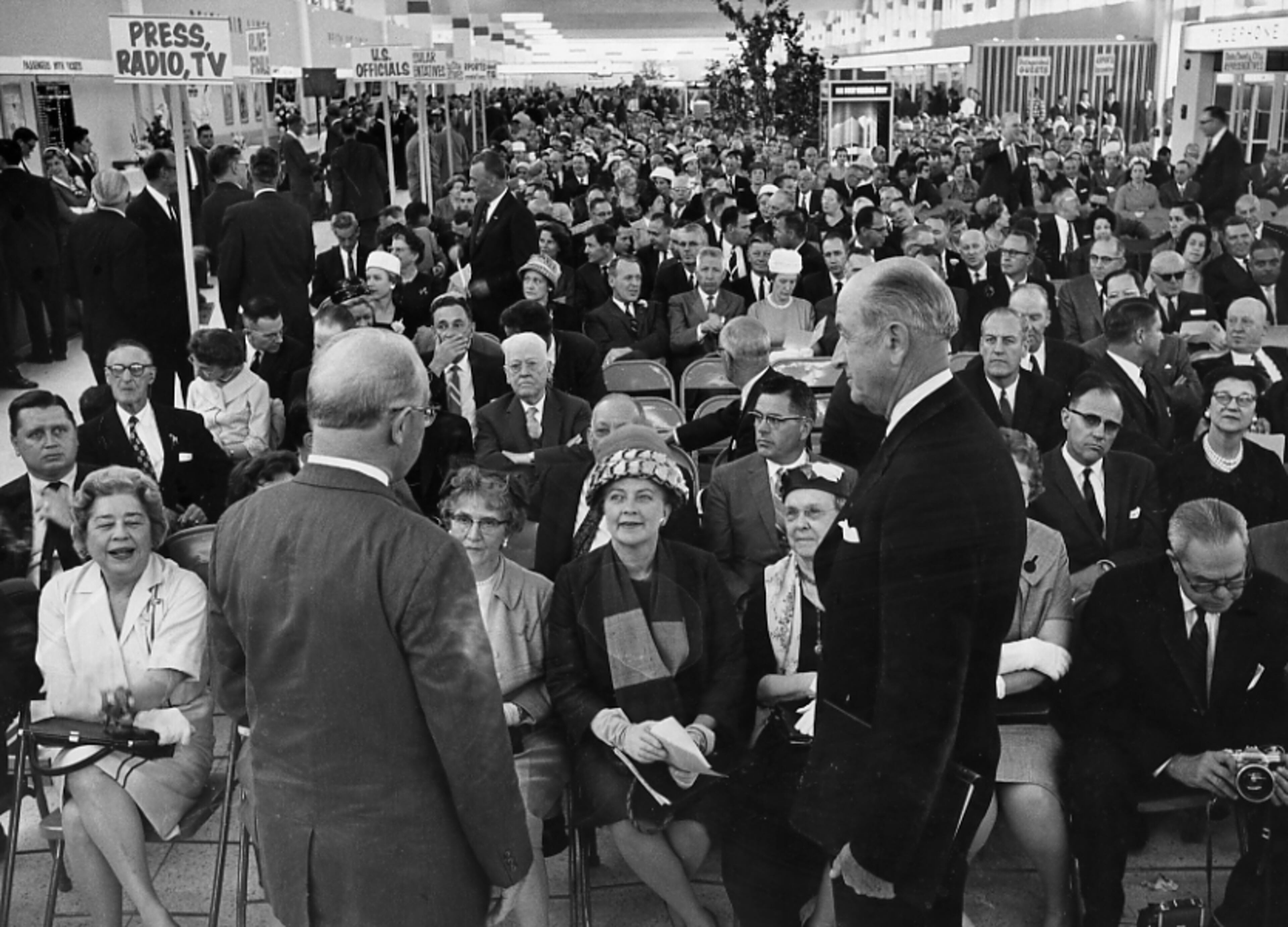 In 1961, crowds thronged the new Atlanta Airport terminal for its dedication ceremonies. World Bank president Eugene Black and Atlanta Mayor William Hartsfield (left) face the expectant audience. (Bill Wilson / AJC File)