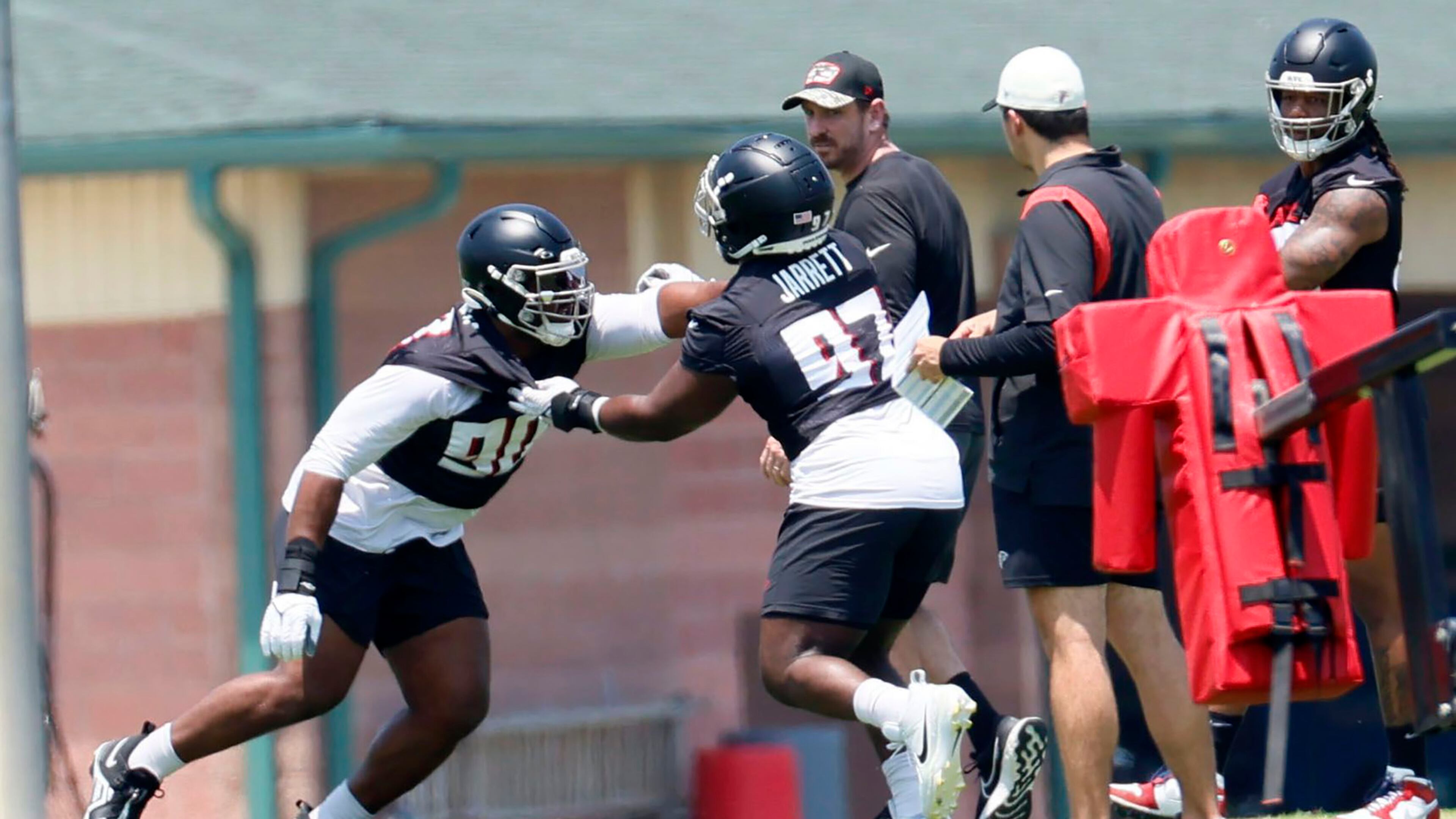 Atlanta Falcons defensive linemen David Onyemata (90) and Grady Jarrett (97) run a drill during OTAs at the Atlanta Falcons Training Camp on June 7, 2023, in Flowery Branch, Georgia. (Miguel Martinez/The Atlanta Journal-Constitution/TNS)