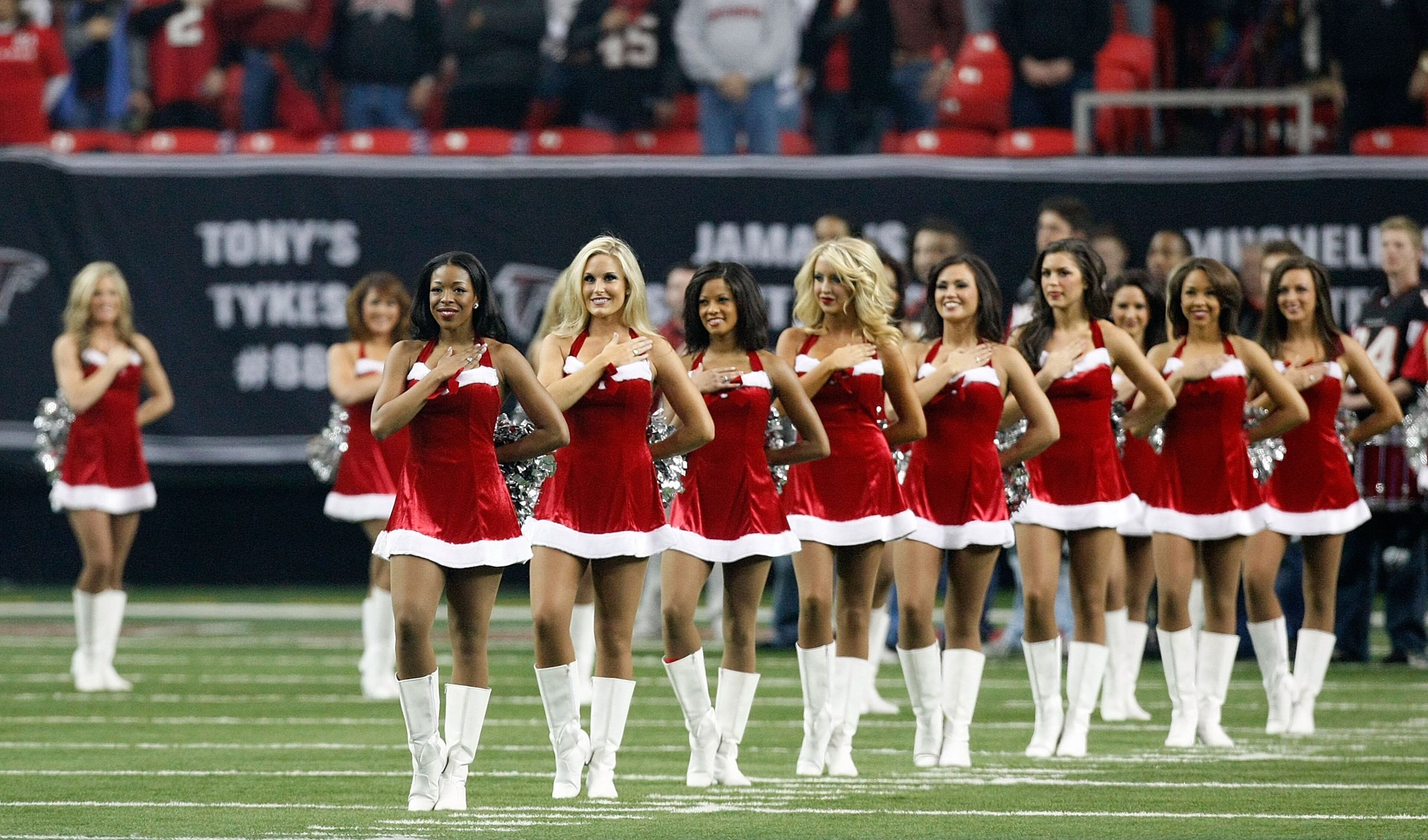 The Atlanta Falcons cheerleaders stand during the National Anthem wearing Christmas outfits before the game against the New Orleans Saints at Georgia Dome on Dec. 13, 2009 in Atlanta.