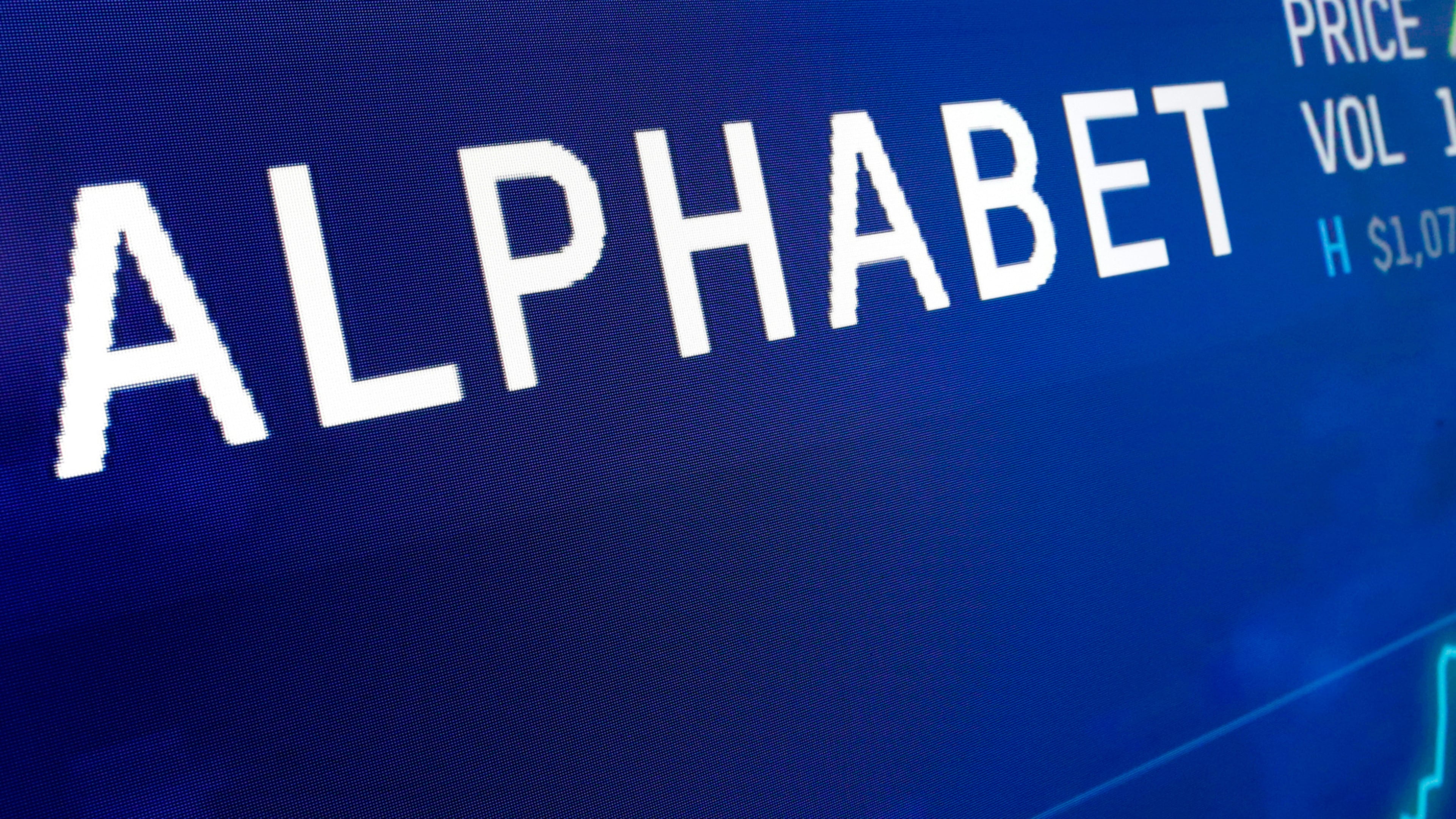 FILE - The logo for Alphabet appears on a screen at the Nasdaq MarketSite in New York, Feb. 14, 2018. (AP Photo/Richard Drew, File)