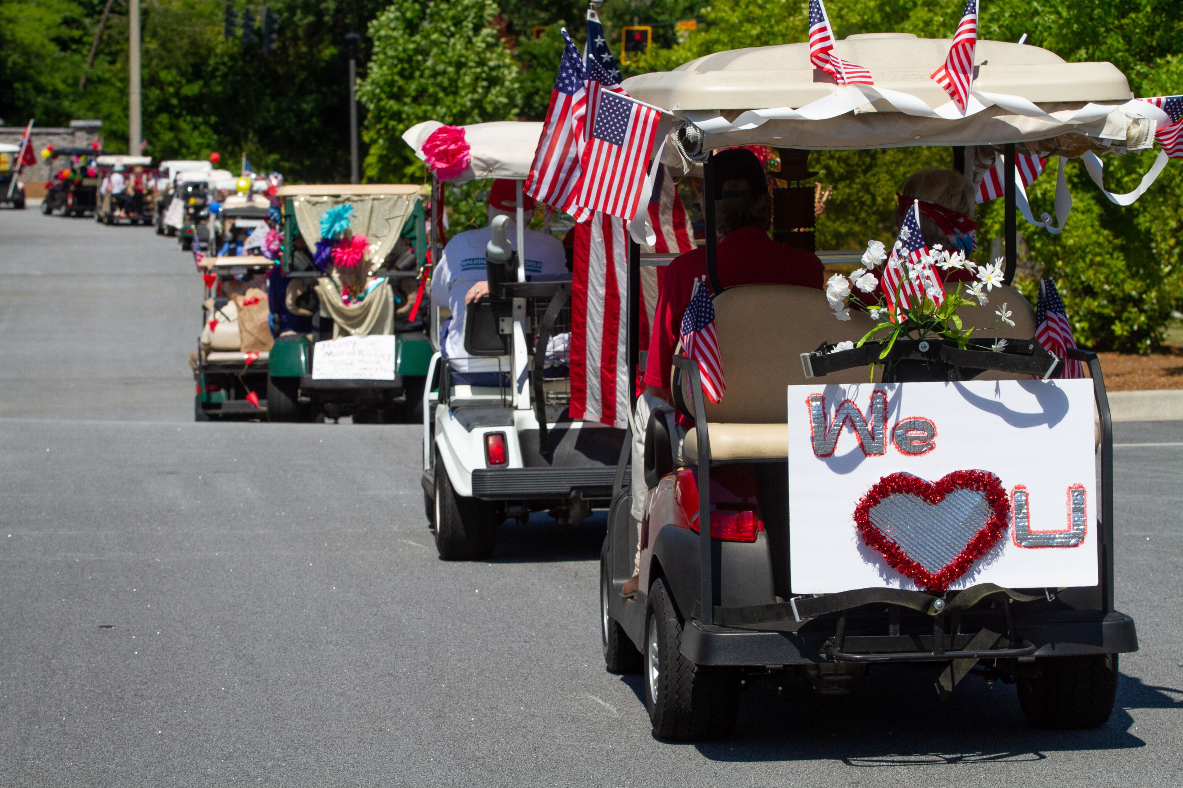 Park Springs independent living residents staged a golf cart parade on Sunday, May 10, 2020, to thank all the staff who have voluntarily remained on the senior community Stone Mountain campus since March 30. STEVE SCHAEFER / SPECIAL TO THE AJC