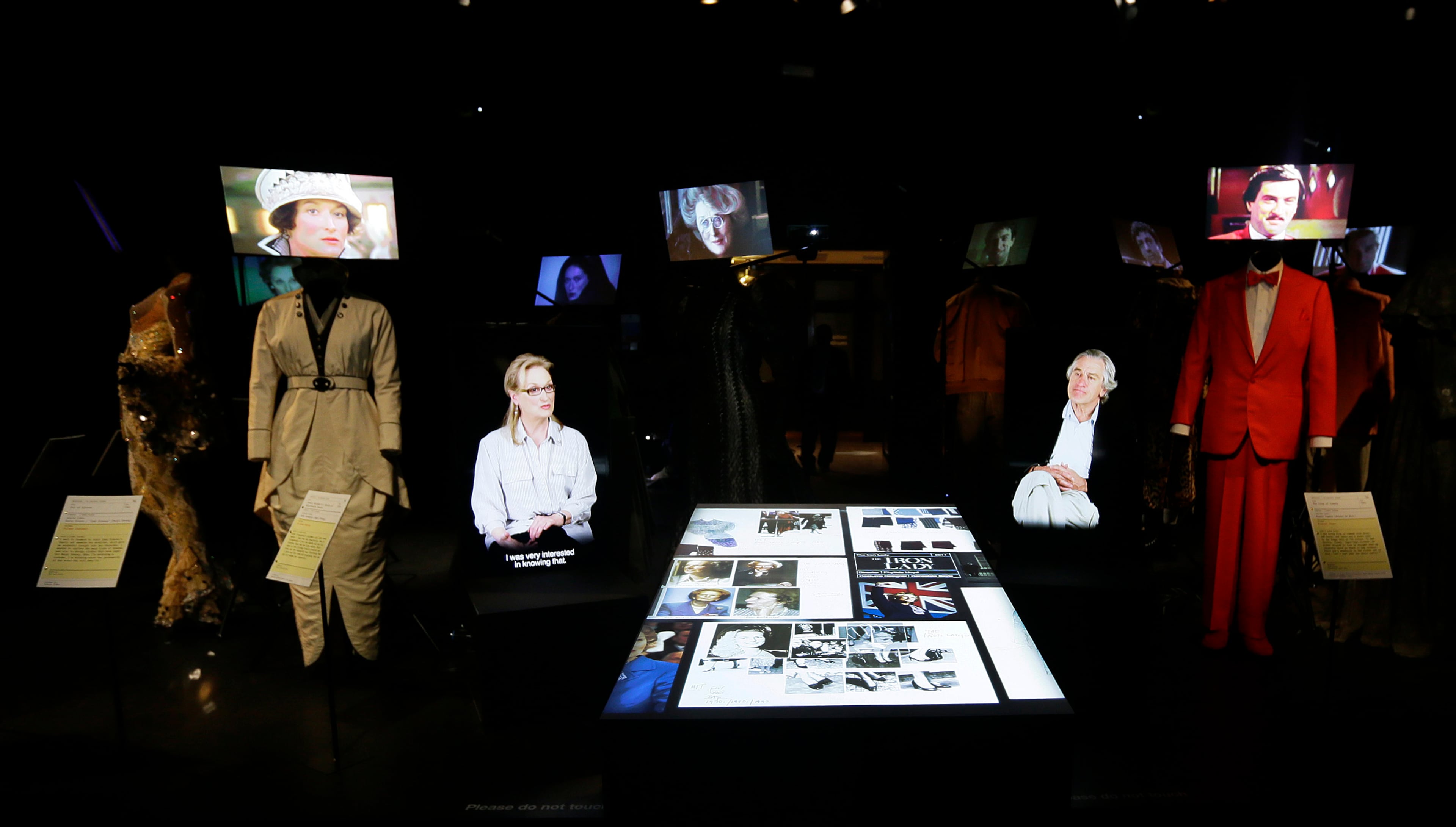 Video presentations by leading American actors Meryl Streep, left and Robert de Niro where they discuss the importance of the costume designer to help with characterization at the Hollywood Costume exhibition at the Victoria and Albert museum in London, Tuesday, Oct. 16, 2012.