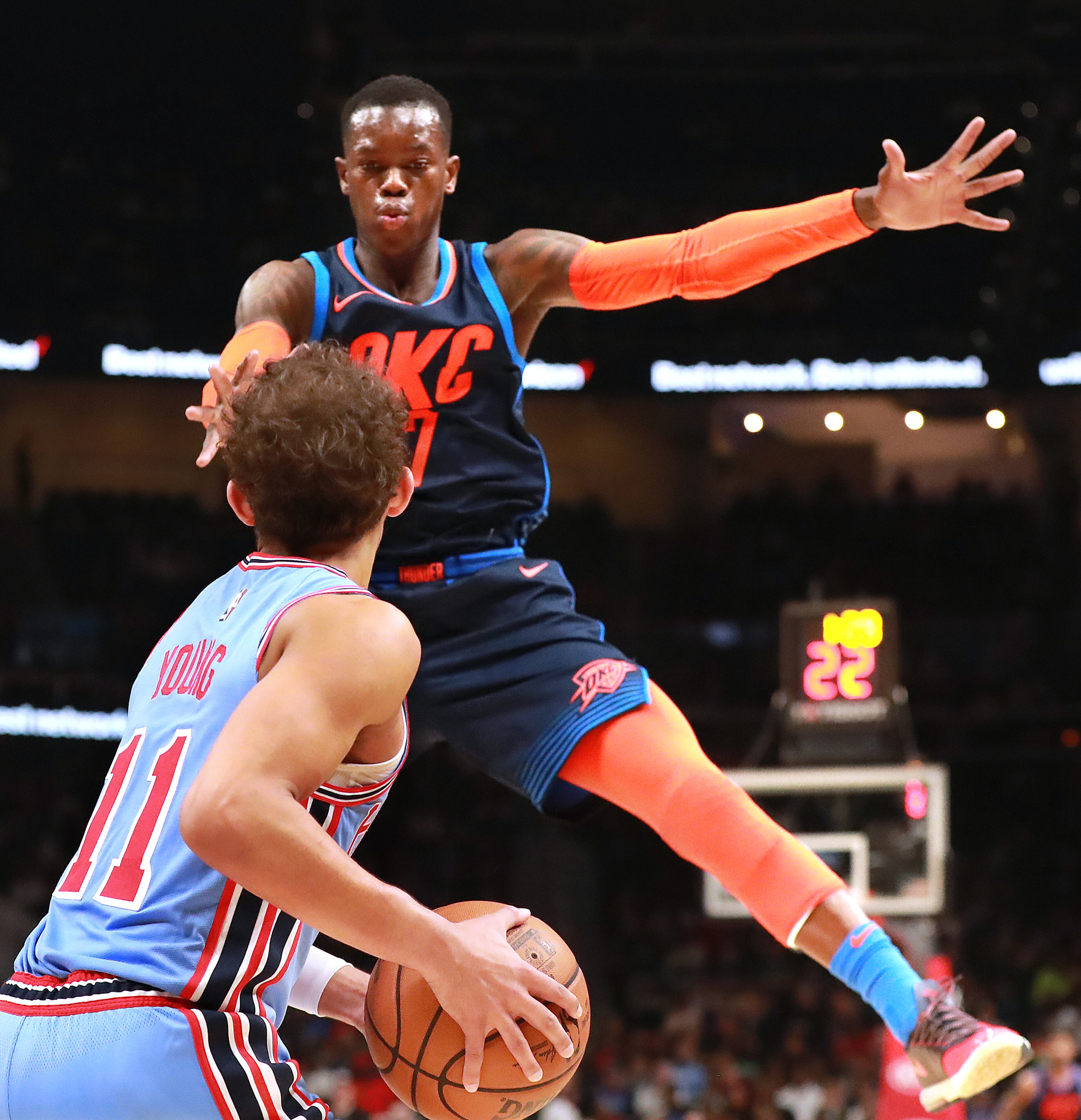 Jan. 15, 2019 Atlanta: Atlanta Hawks guard Trae Young looks to pass around Oklahoma City Thunder guard Dennis Schroder during the second half in a NBA basketball game on Tuesday, Jan. 15, 2019, at State Farm Arena in Atlanta. Curtis Compton/ccompton@ajc.com
