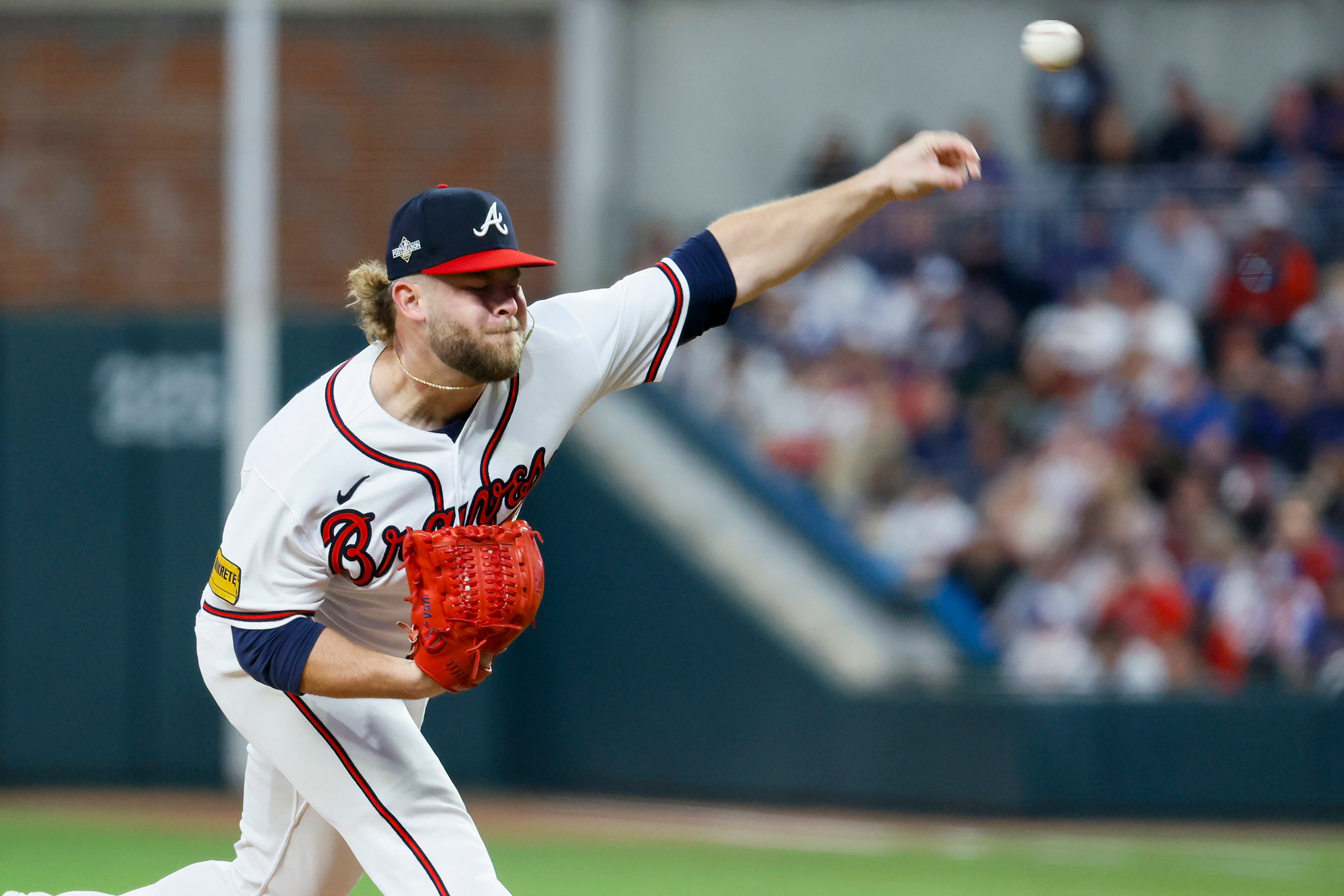 Atlanta Braves relief pitcher A.J. Minter (33) delivers to the Philadelphia Phillies during the eighth inning of NLDS Game 2 in Atlanta on Monday, Oct. 9, 2023. (Miguel Martinez / Miguel.Martinezjimenez@ajc.com)