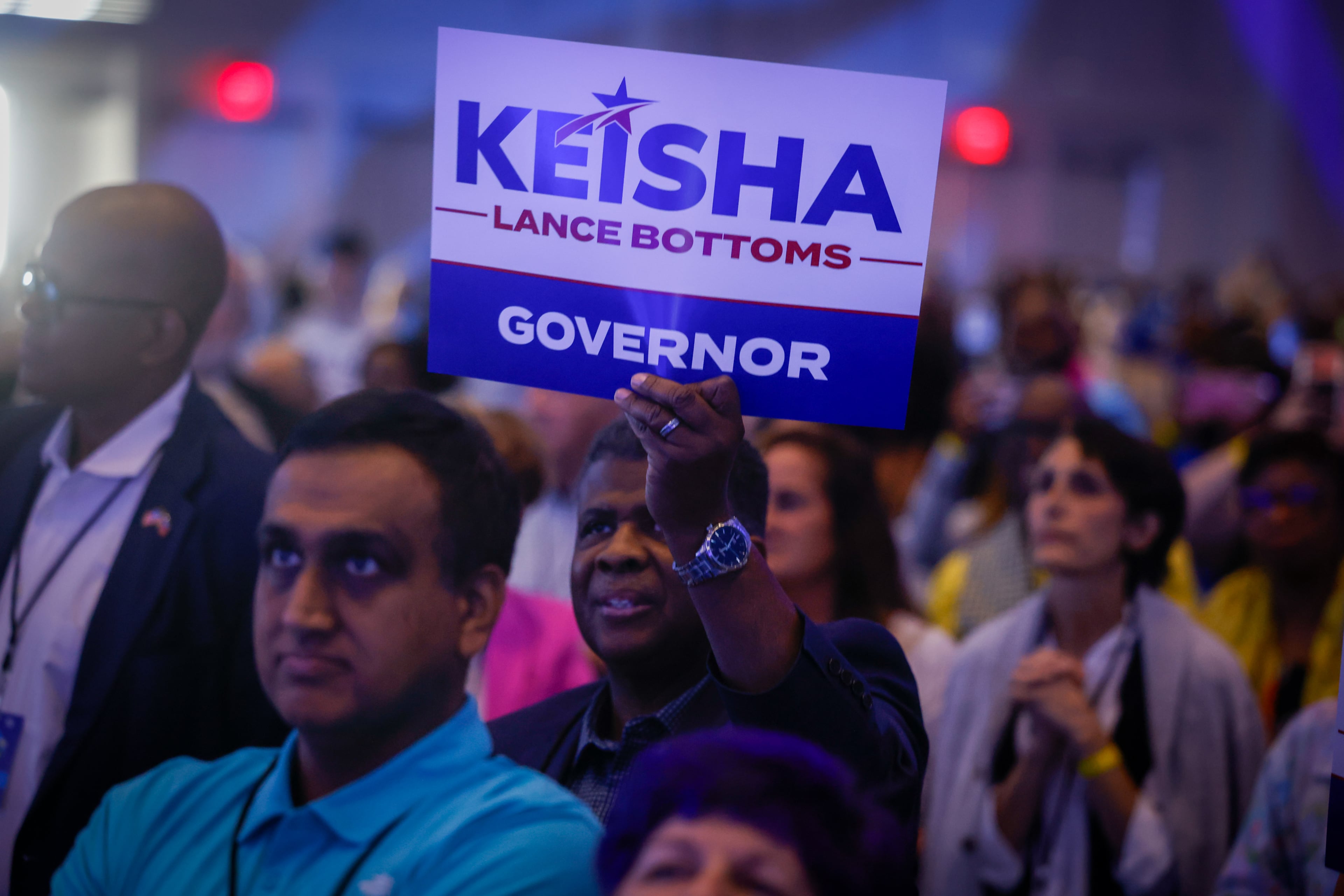 Attendees hold signs for Democratic gubernatorial candidate Keisha Lance Bottoms at the Georgia Democratic Convention at the Savannah Convention Center in Savannah on Saturday, Aug. 1, 2026. (Arvin Temkar/AJC)