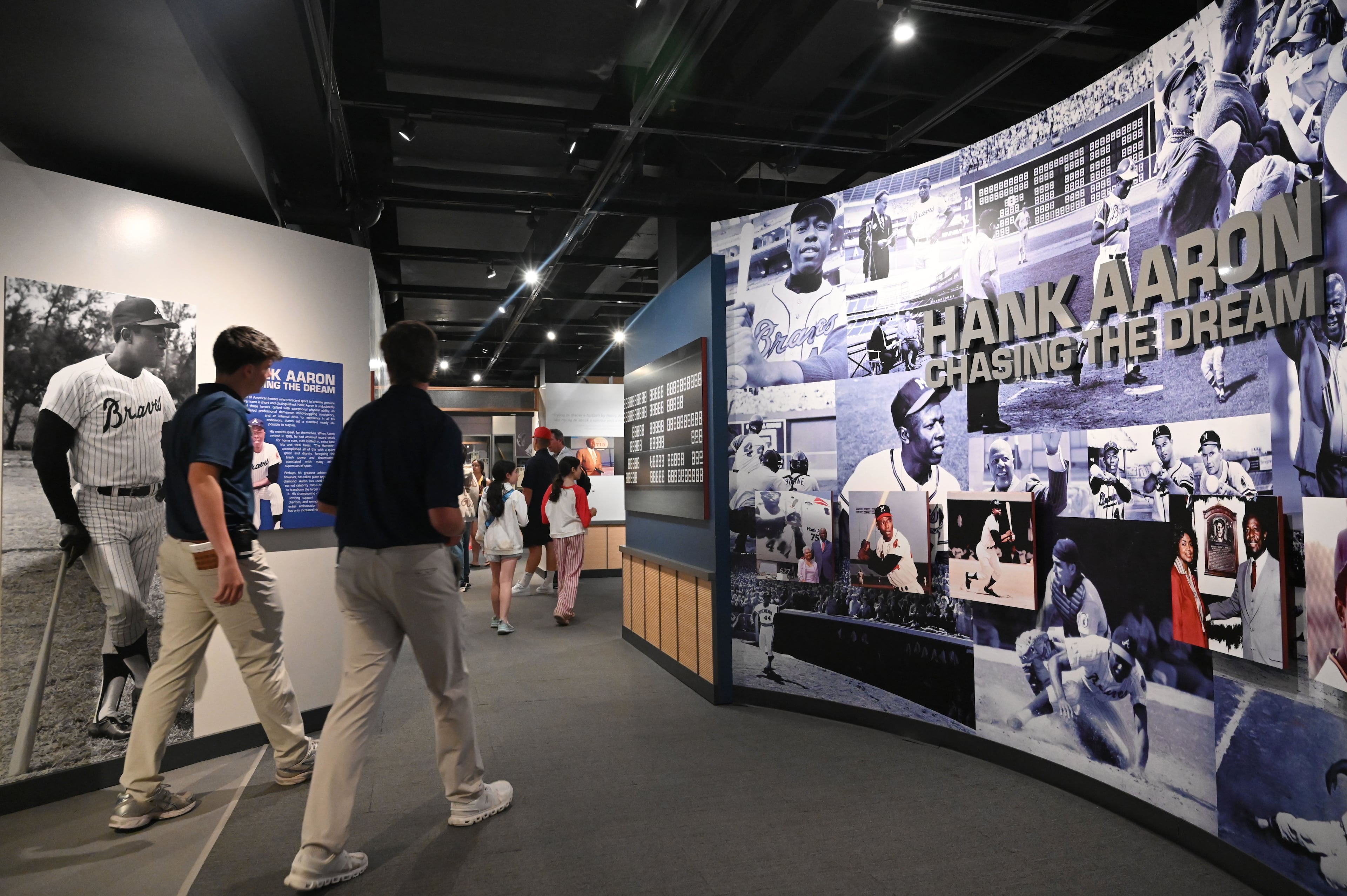 Baseball fans check out Hank Aaron Gallery at the National Baseball Hall of Fame and Museum on Friday, July 24, 2026, in Cooperstown, N.Y. Andruw Jones will be inducted into the National Baseball Hall of Fame on Sunday as part of the Class of 2026, alongside Carlos Beltrán and Jeff Kent. He is recognized as one of the greatest center fielders in baseball history. Jones will become the 12th player with ties to the Atlanta Braves to be inducted into the Hall of Fame. (Hyosub Shin/AJC)