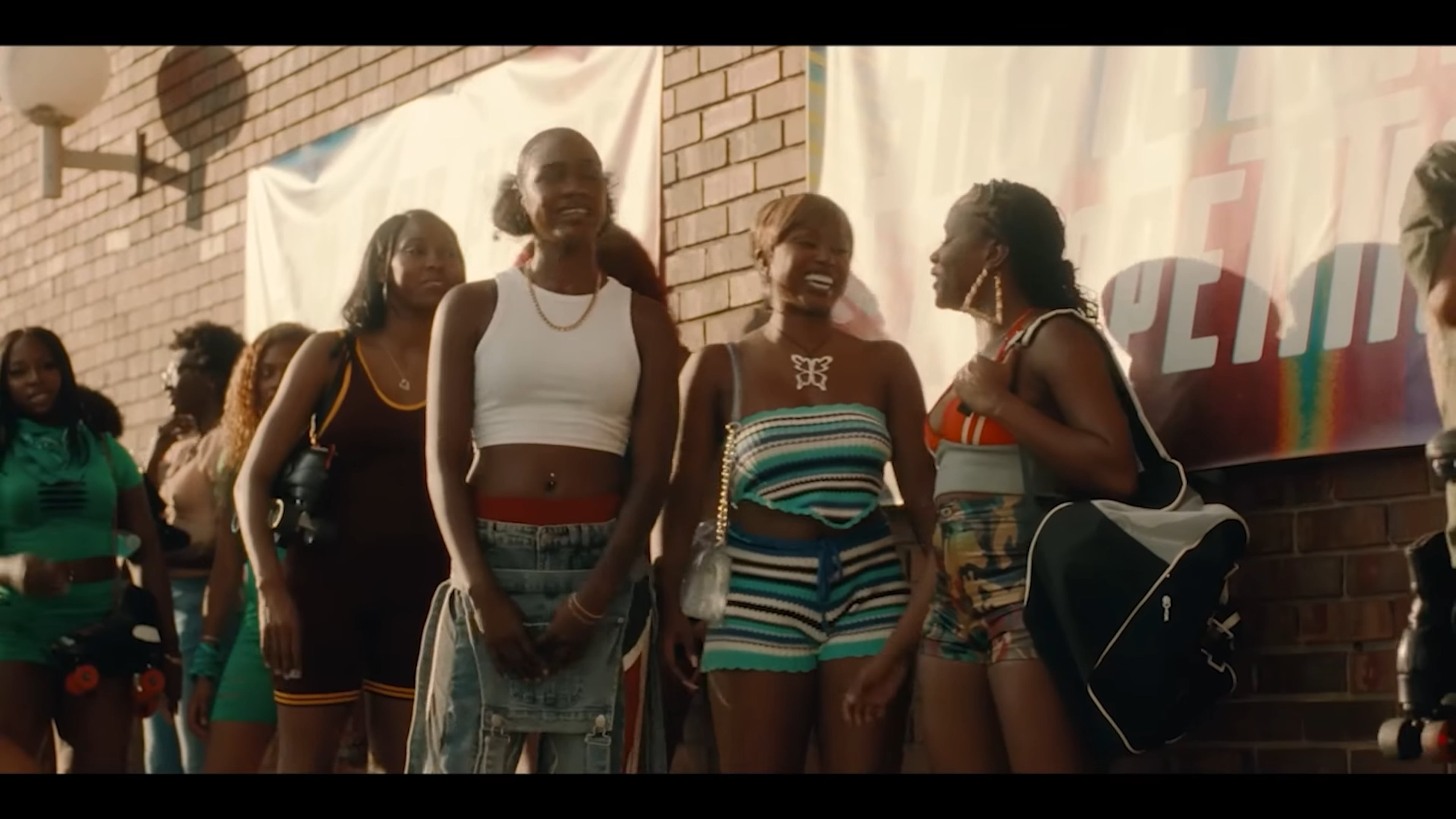 The ladies of "G.R.I.T.S." stand outside the former Skate Along USA in Lilburn where the fictional characters compete in a skating contest for $50,000. Skate Along USA closed in August 2025 after 48 years. (Courtesy of ALLBLK)