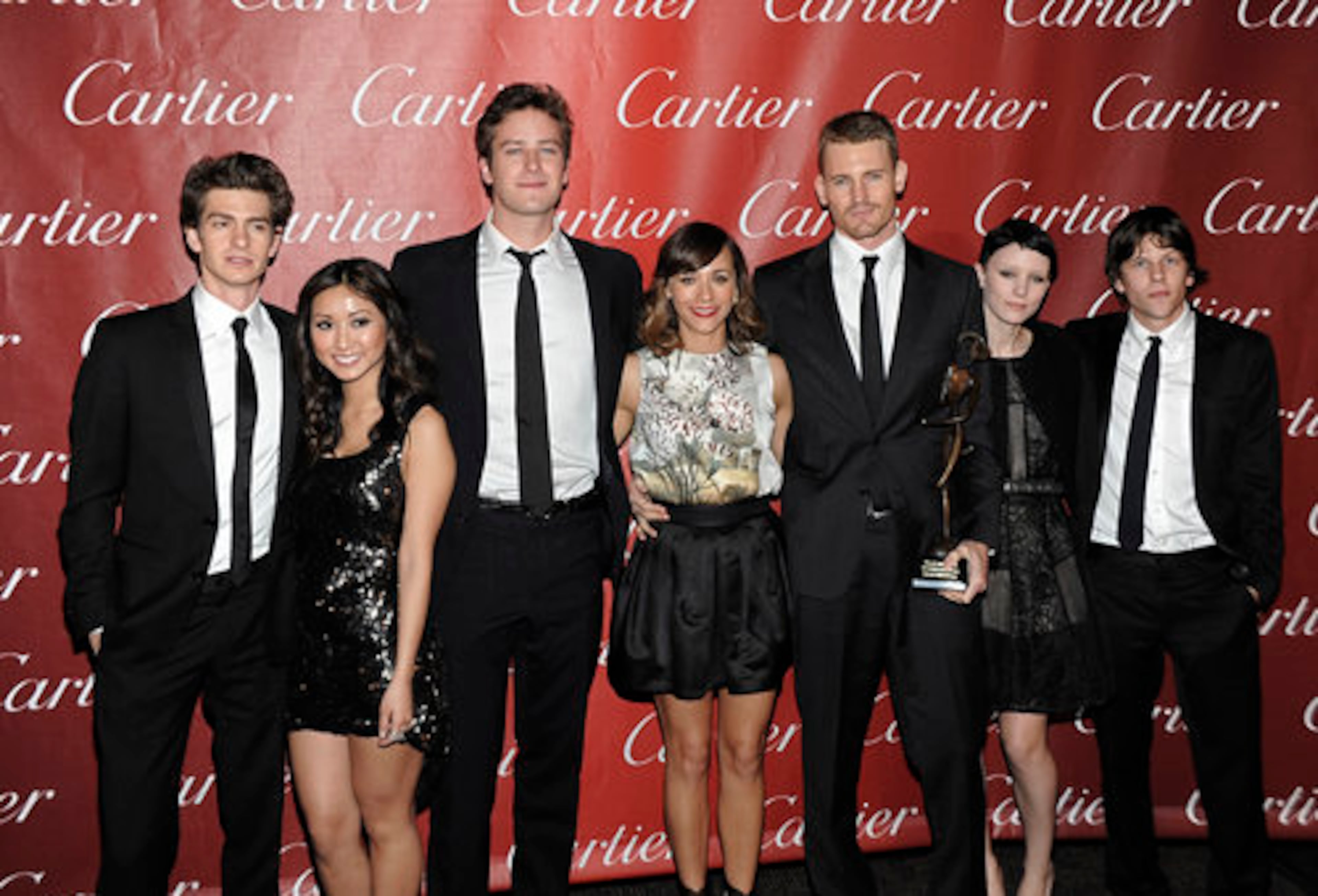 From left to right, actor Andrew Garflield, Actress Brenda Song, actor Armie Hammer, actress Rashida Jones, actor Josh Pence, actress Rooney Mara, actor Jesse Eisenberg pose together with their Ensemble Performance award for the feature film "The Social Network" at the 2011 Palm Springs International Film Festival Awards Gala in Palm Springs, Calif. on Saturday, Jan. 8, 2011.