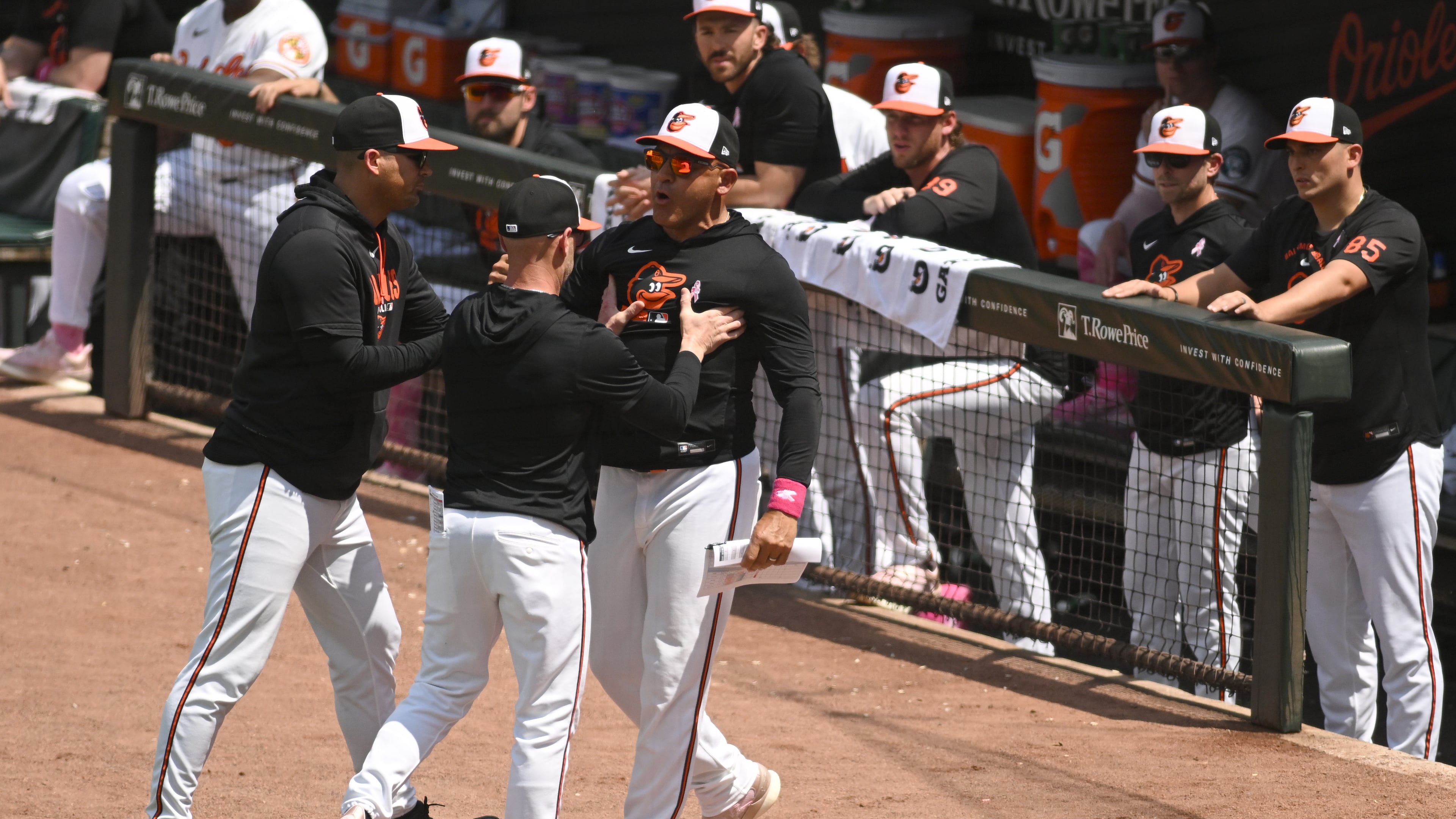 Baltimore Orioles' infield coach Miguel Cairo, center, argues after being ejected from a baseball game against the Athletics, Sunday, May 10, 2026, in Baltimore. (AP Photo/Steve Ruark)
