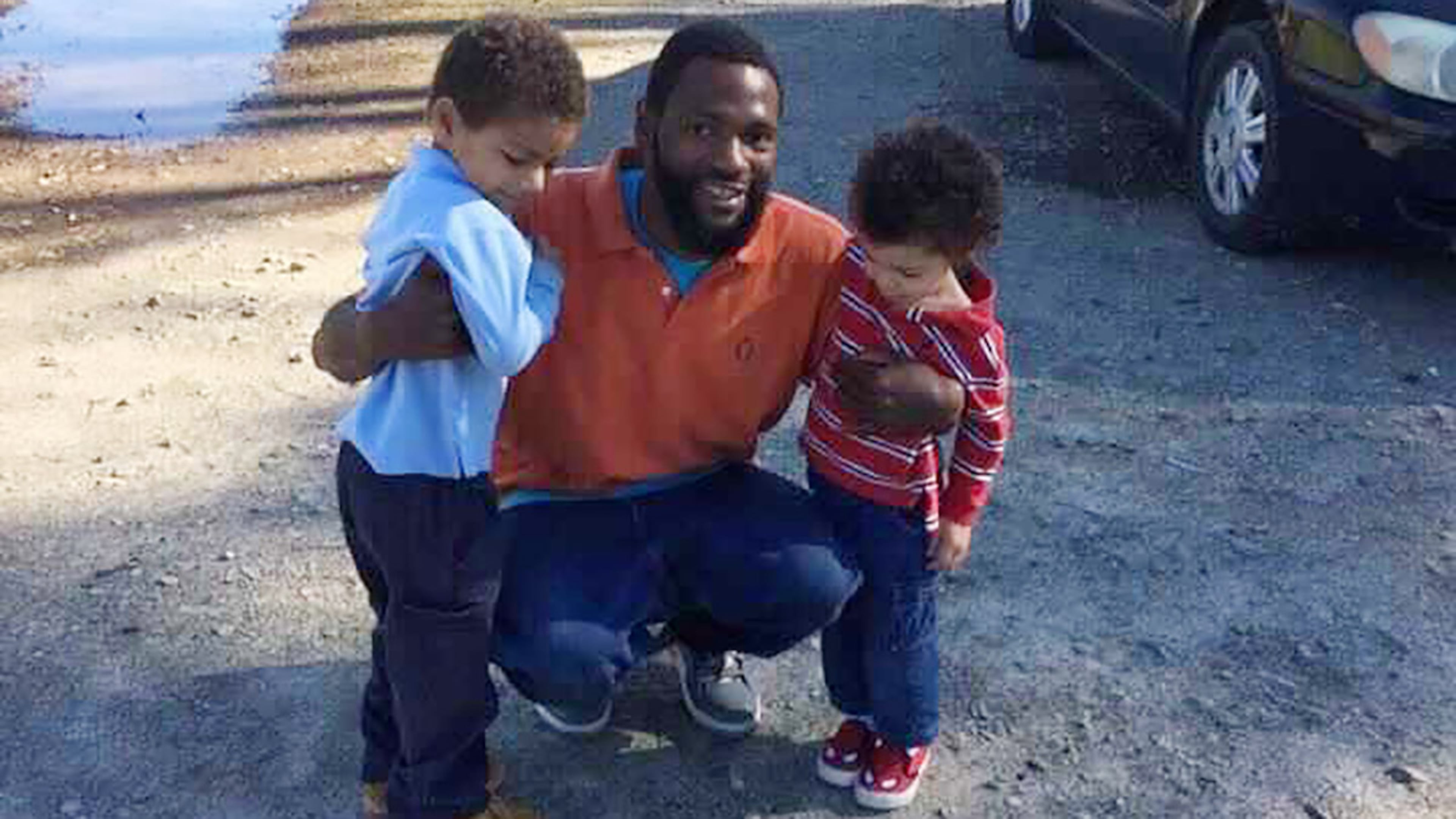 In this 2015 family photo, Antonio May poses with his sons Za'Kobe and Jordan Rickerson. In September 2018, May was pronounced dead after being repeatedly shocked with a Taser in the Fulton County Jail. (Courtesy of May attorney Michael Harper)